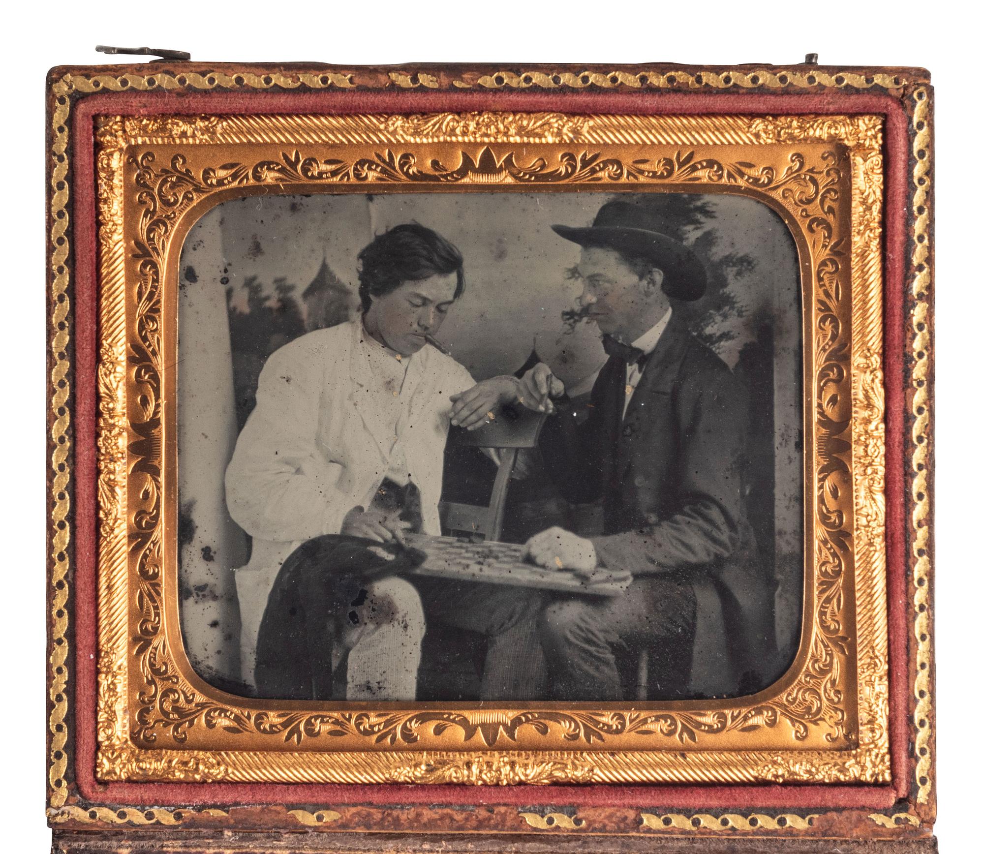 [EARLY PHOTOGRAPHY]. Sixth plate ruby ambrotype showing an intense game of checkers.