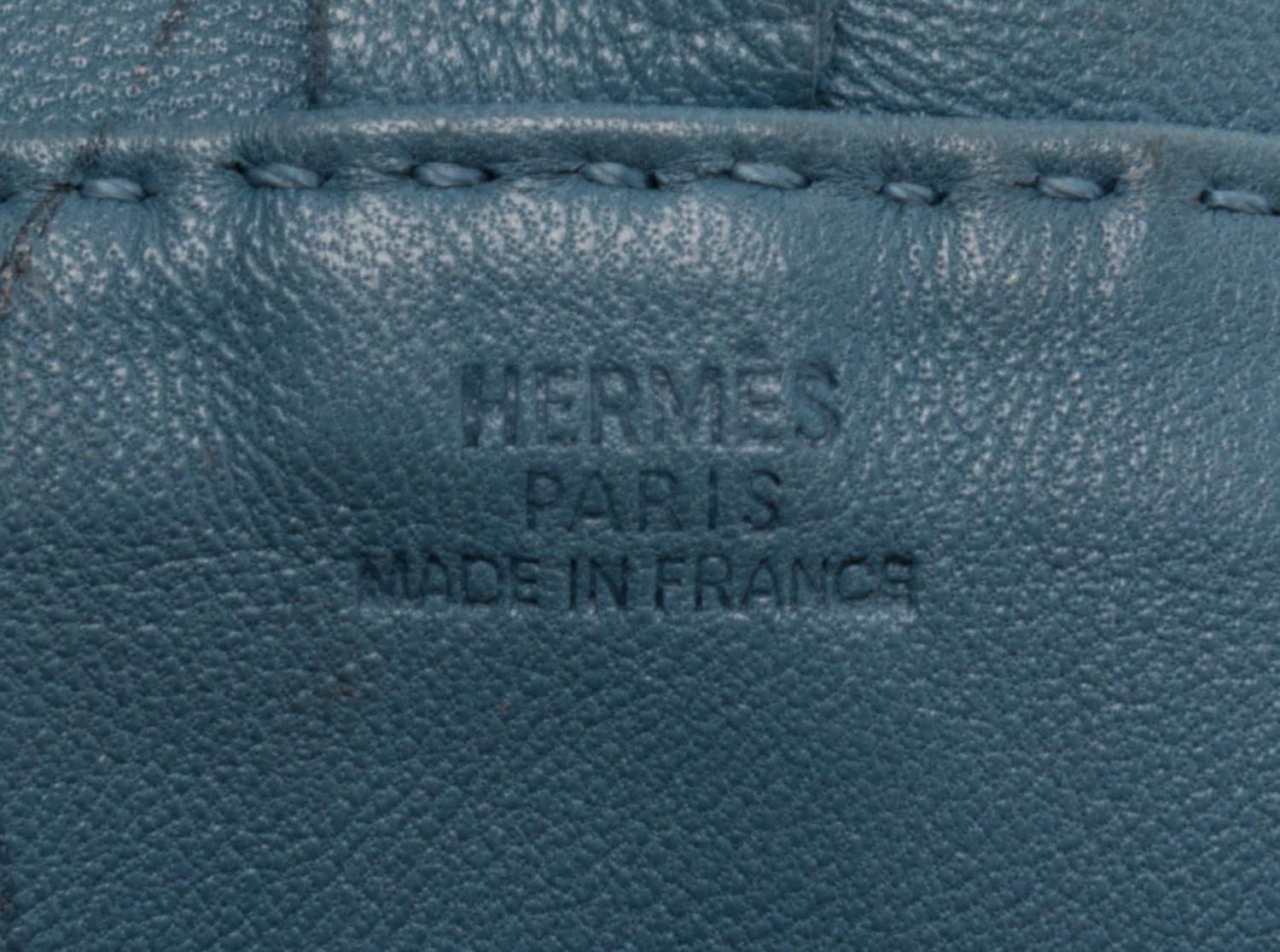 An Hermes Bleu Lin Agneau Clou de Selle Pouch, 6" x 9" x 1".