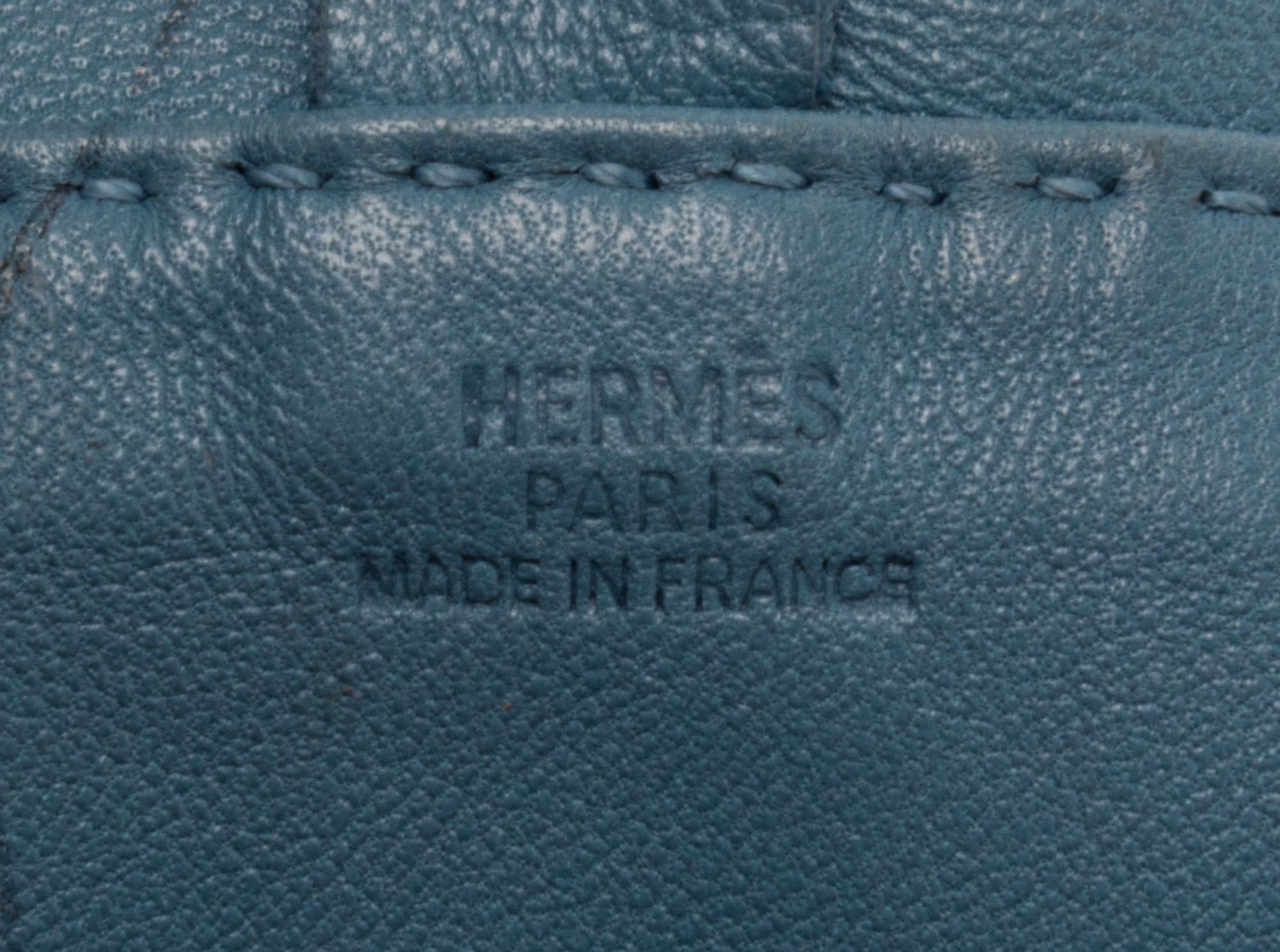 An Hermes Bleu Lin Agneau Clou de Selle Pouch, 6" x 9" x 1".