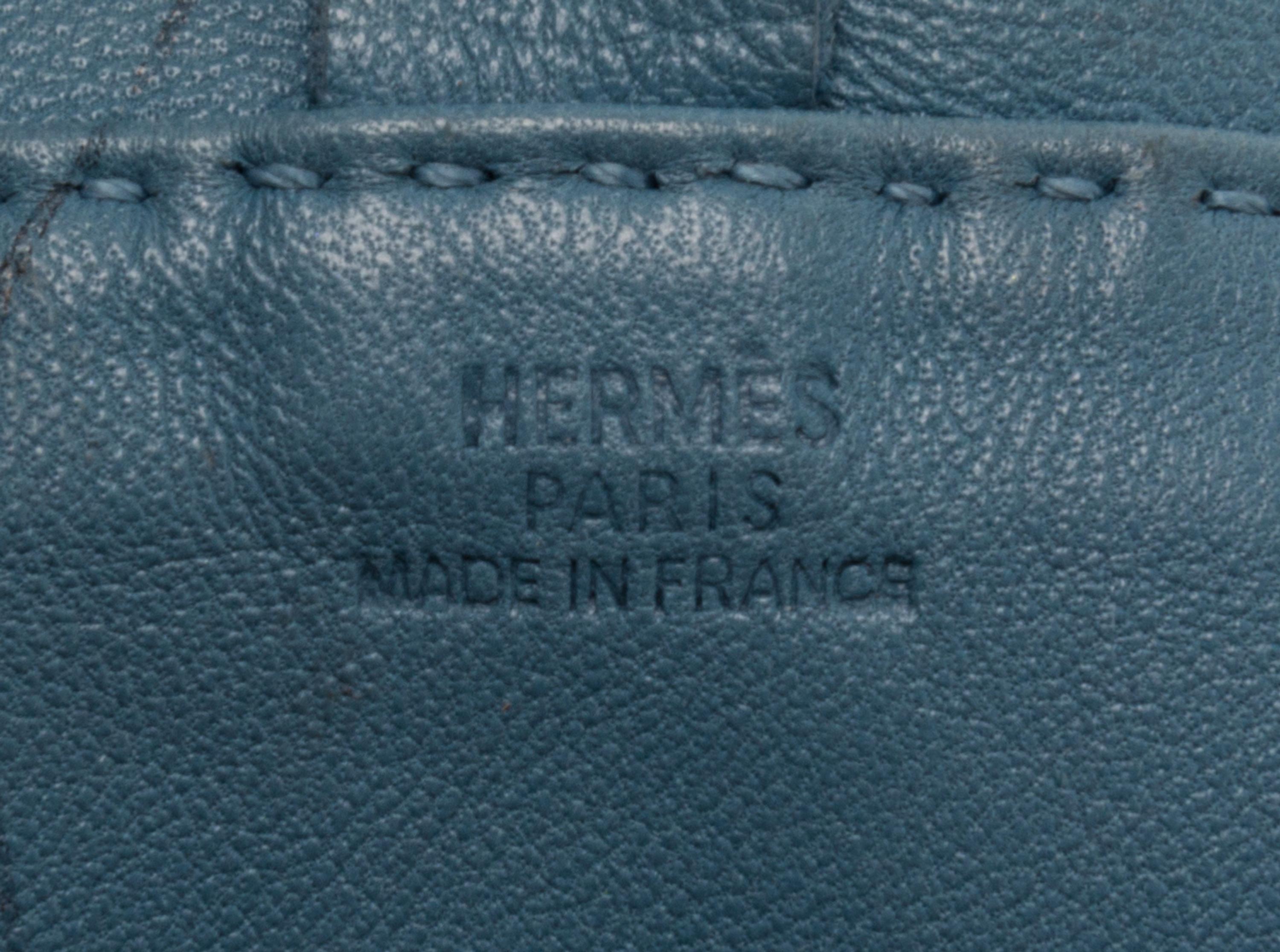 An Hermes Bleu Lin Agneau Clou de Selle Pouch, 6" x 9" x 1".