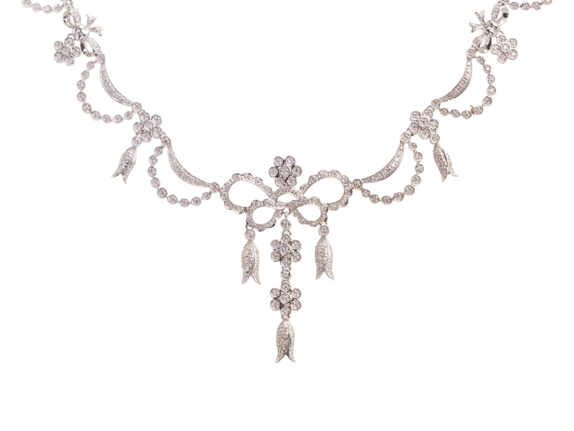A 14 Karat White Gold and Diamond Festoon Necklace,