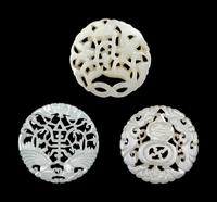 Three Chinese Pale Celadon Jade Circular Reticulated Plaques