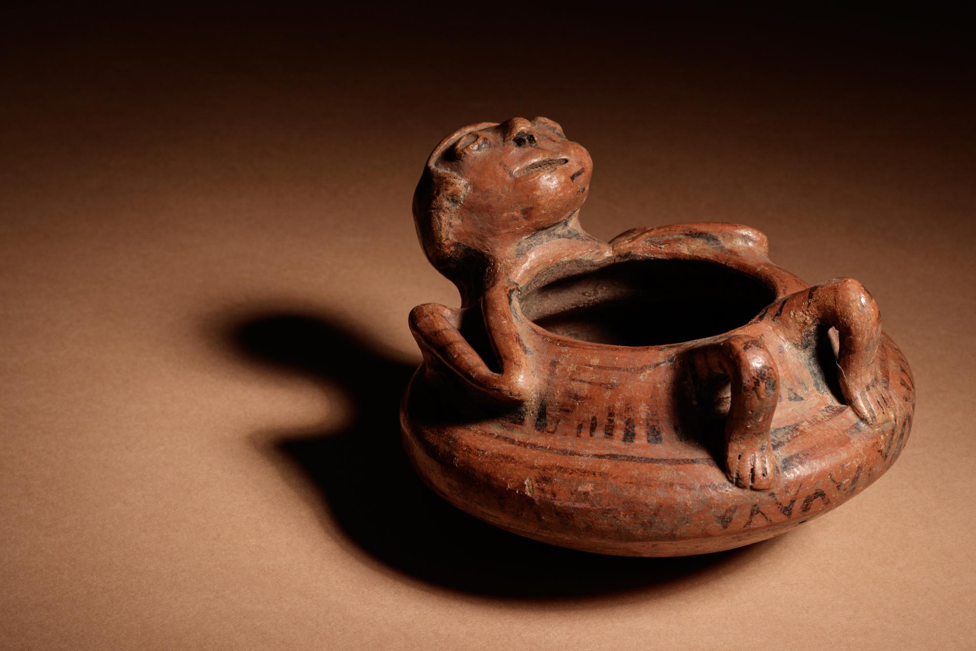 A Narino Terracotta Vessel of a Lying Man