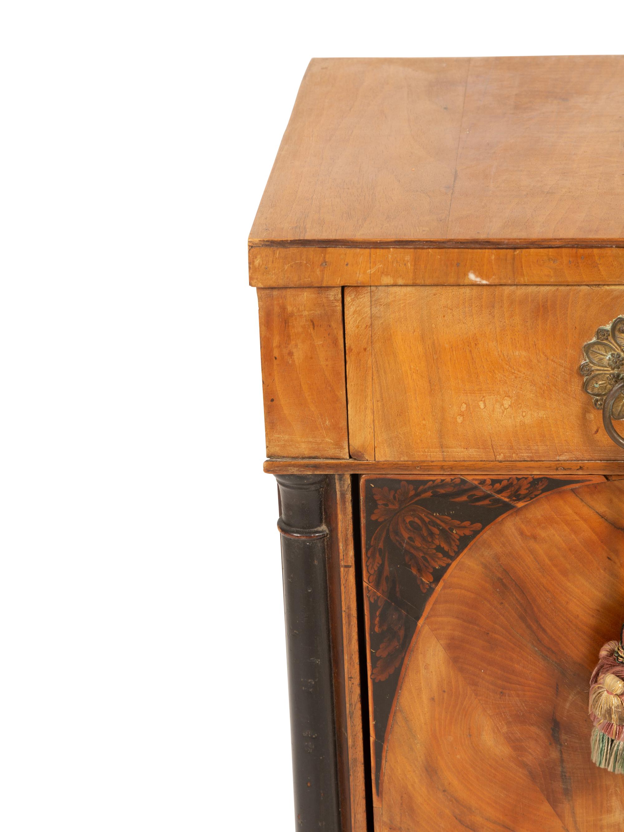 A Northern Italian Walnut and Ebonized Bedside Cabinet