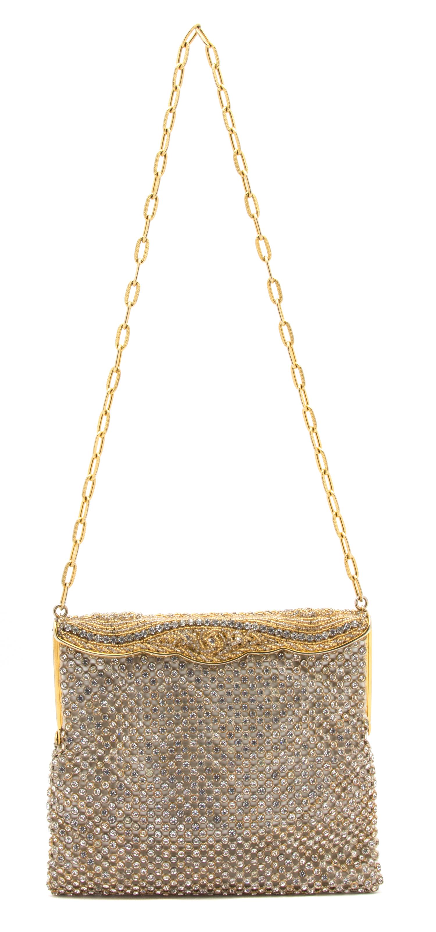 A Goldtone and Rhinestone Evening Bag, 7" x 6" x .25".