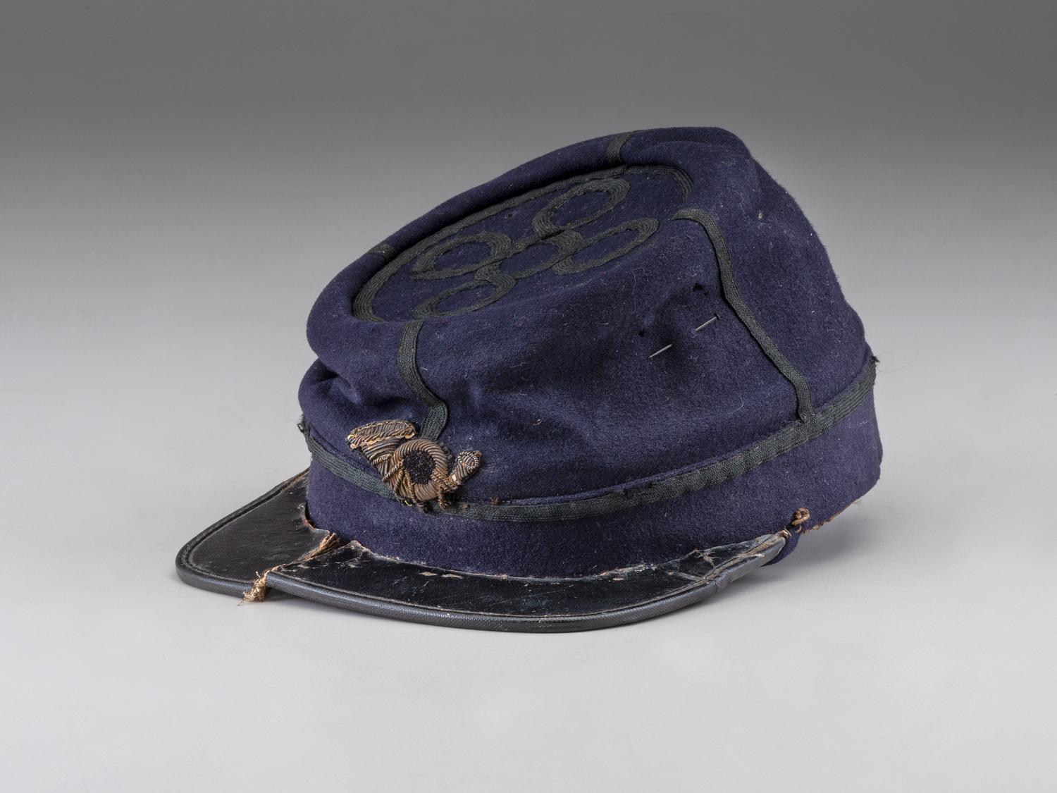 [CIVIL WAR]. Private purchase officer's sack coat, kepi, and carpet bag identified to Lieutenant Albert C. Sparks, Co. B, 37th Massachusetts Volunteers.