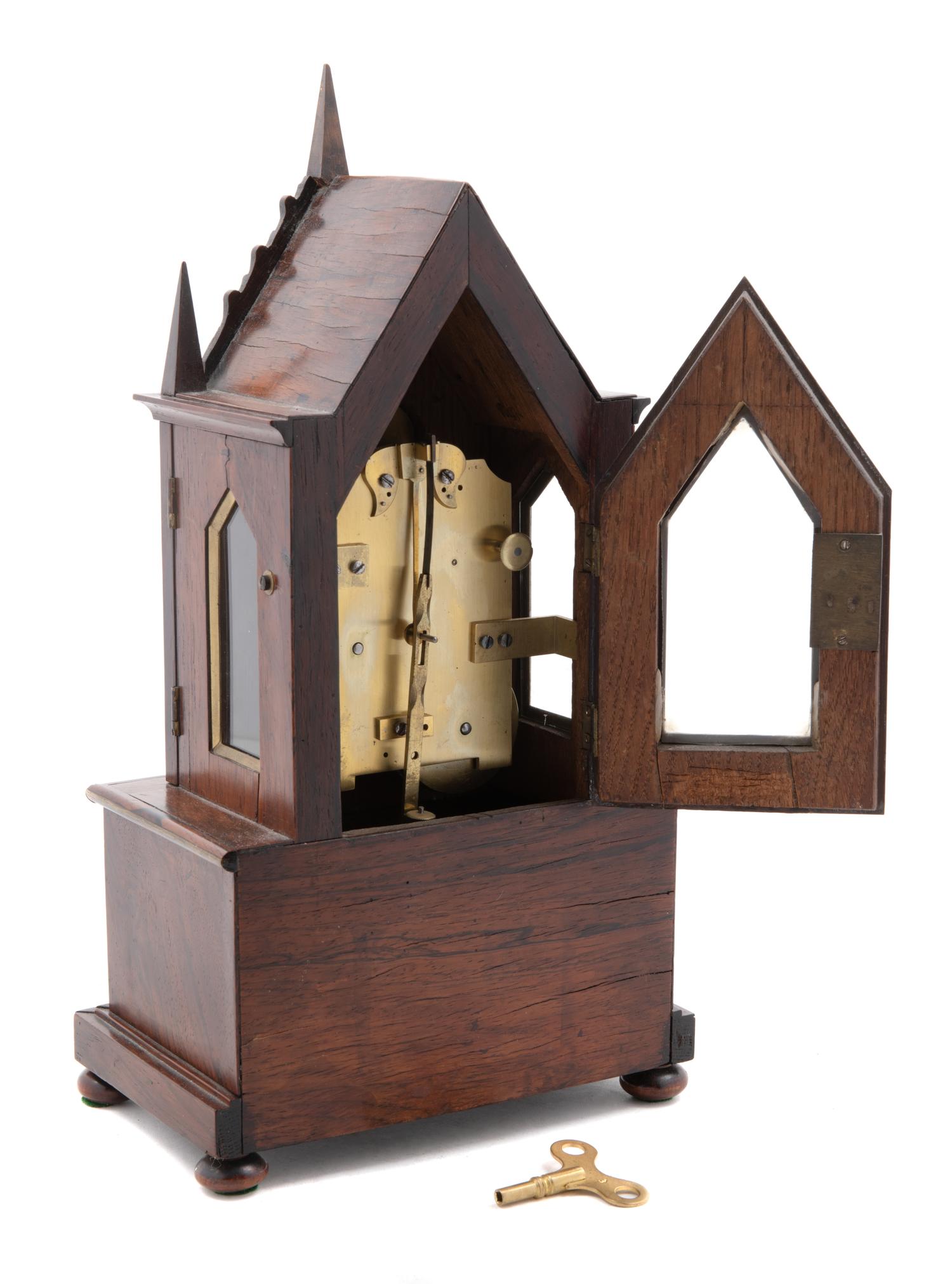 A Gothic Revival Brass Mounted Mantel Clock