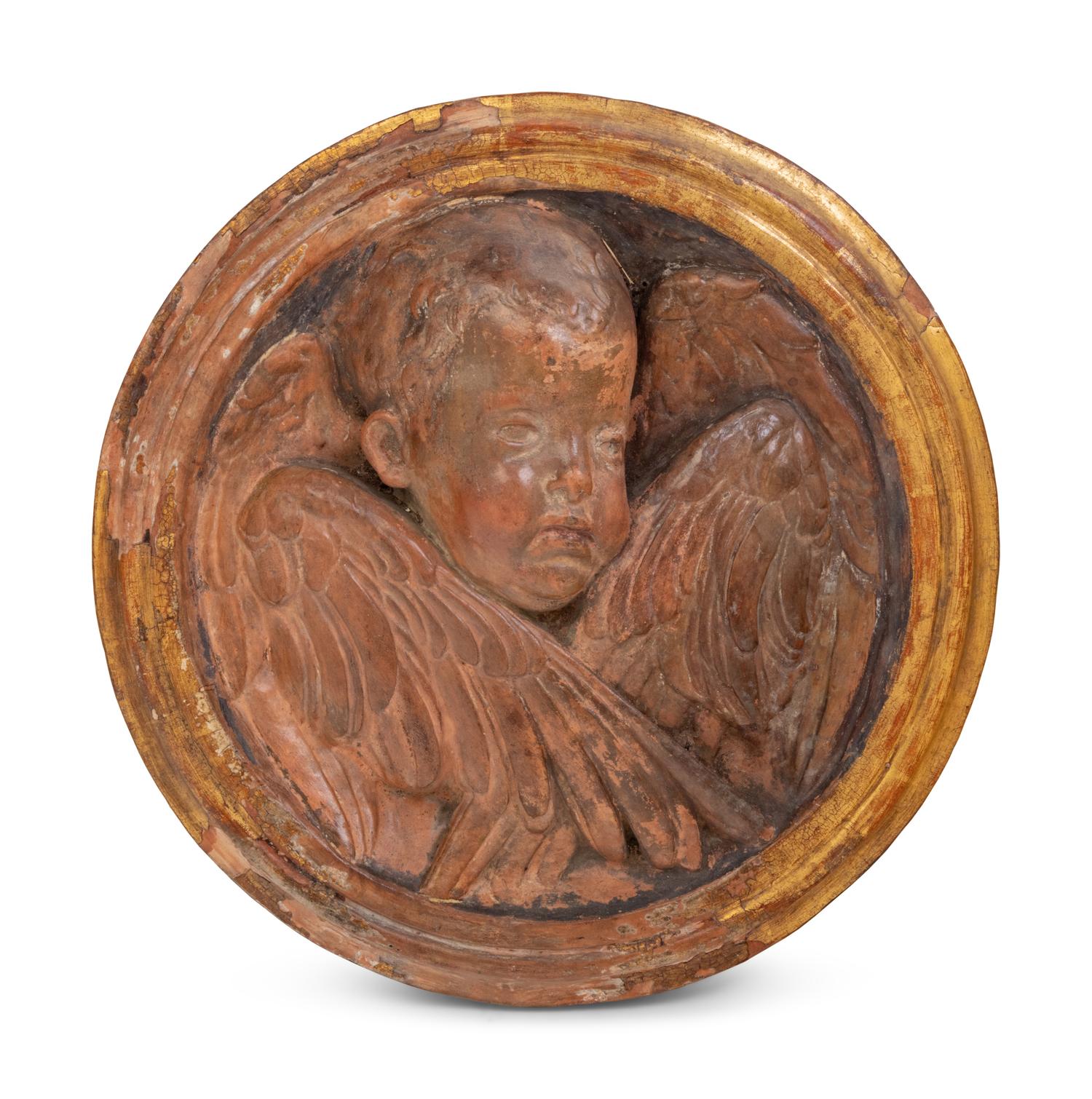 A Continental Parcel Gilt Terra Cotta Cherub Plaque