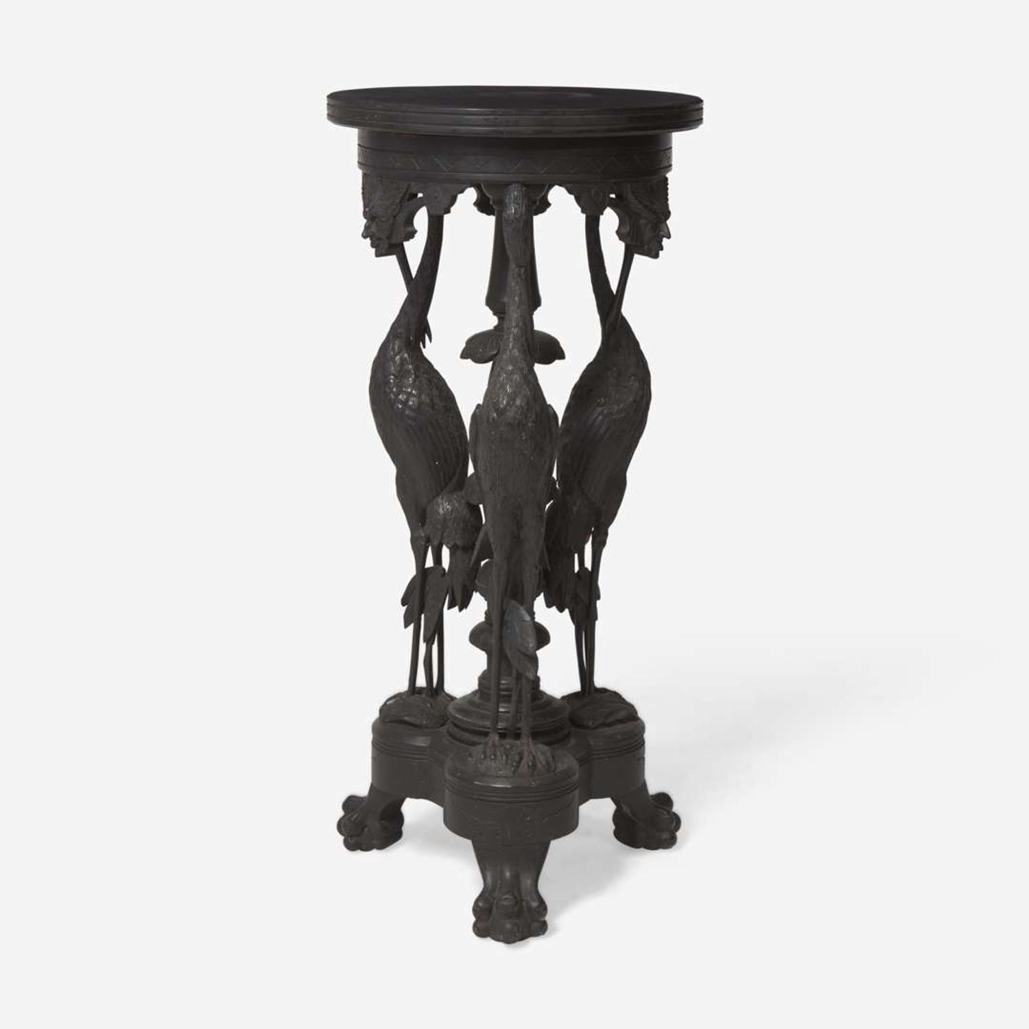 An Aesthetic Movement carved and ebonized wood pedestal with cranes late 19th century