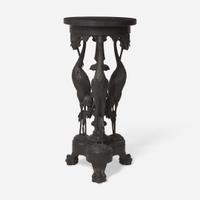 An Aesthetic Movement carved and ebonized wood pedestal with cranes late 19th century
