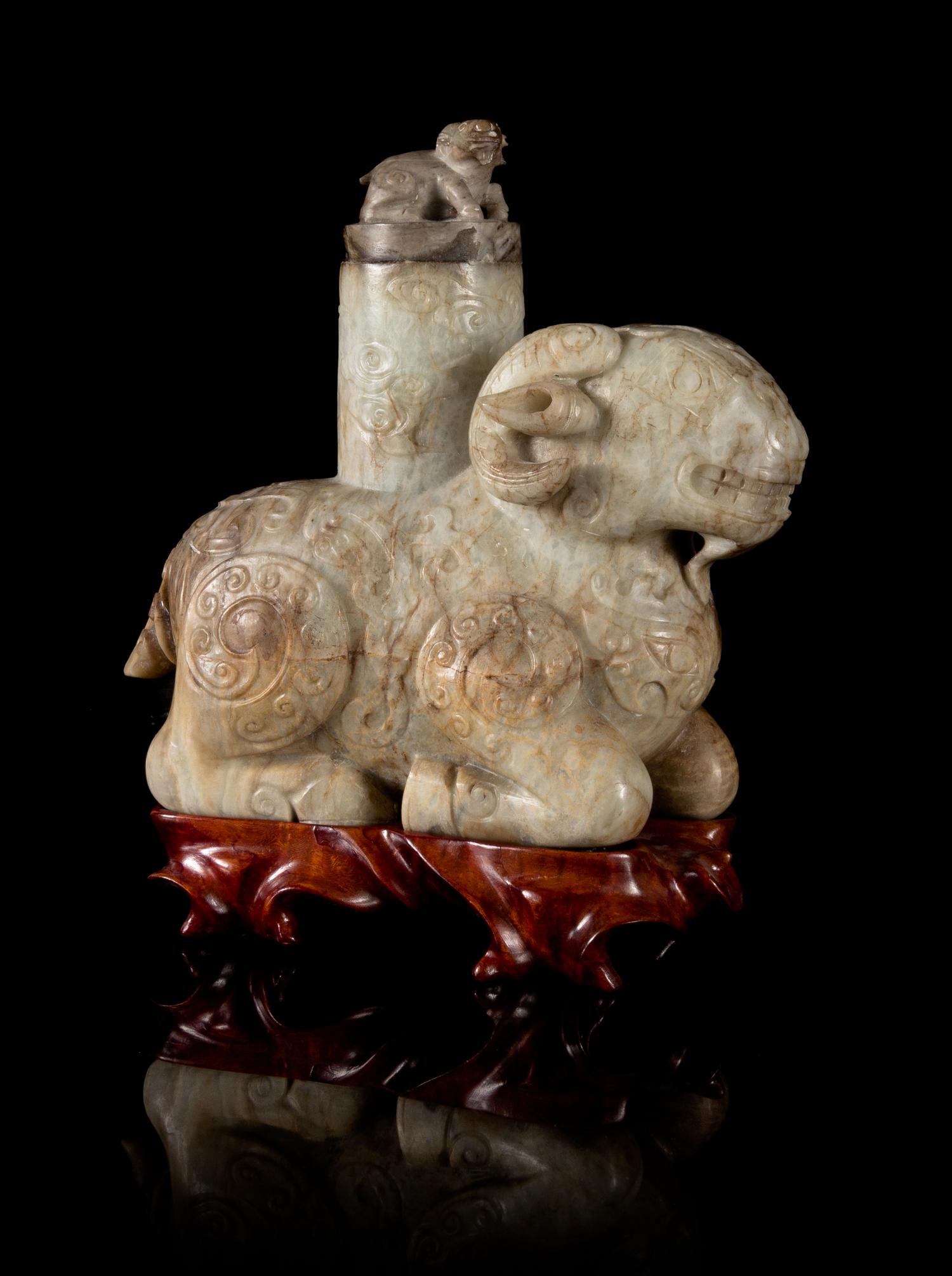 A Chicken Bone Jade Archaistic Ram-Form Vessel