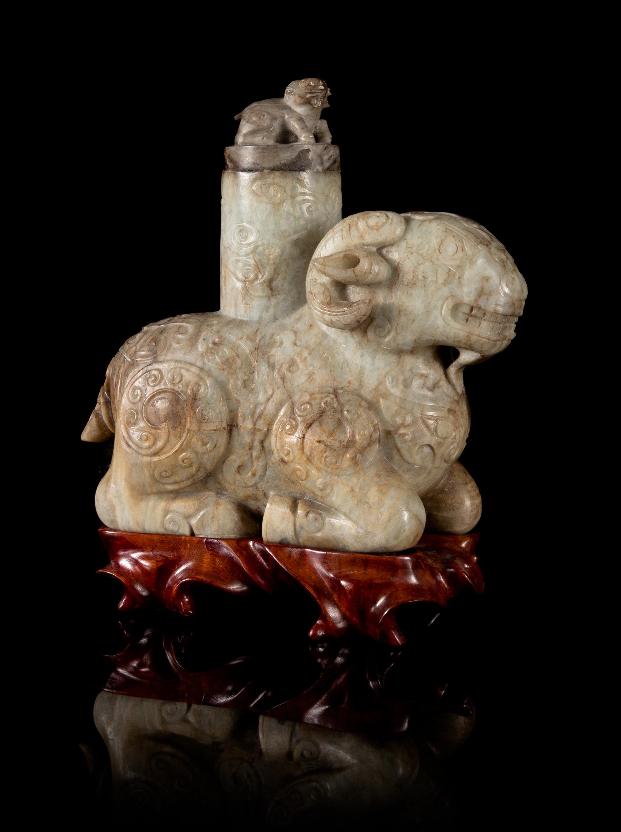 A Chicken Bone Jade Archaistic Ram-Form Vessel