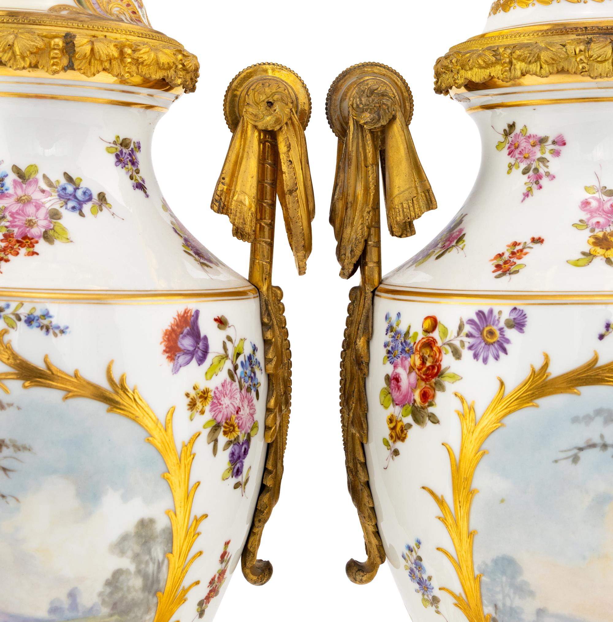 A Pair of Sèvres Style Porcelain and Gilt Bronze Mounted Urns