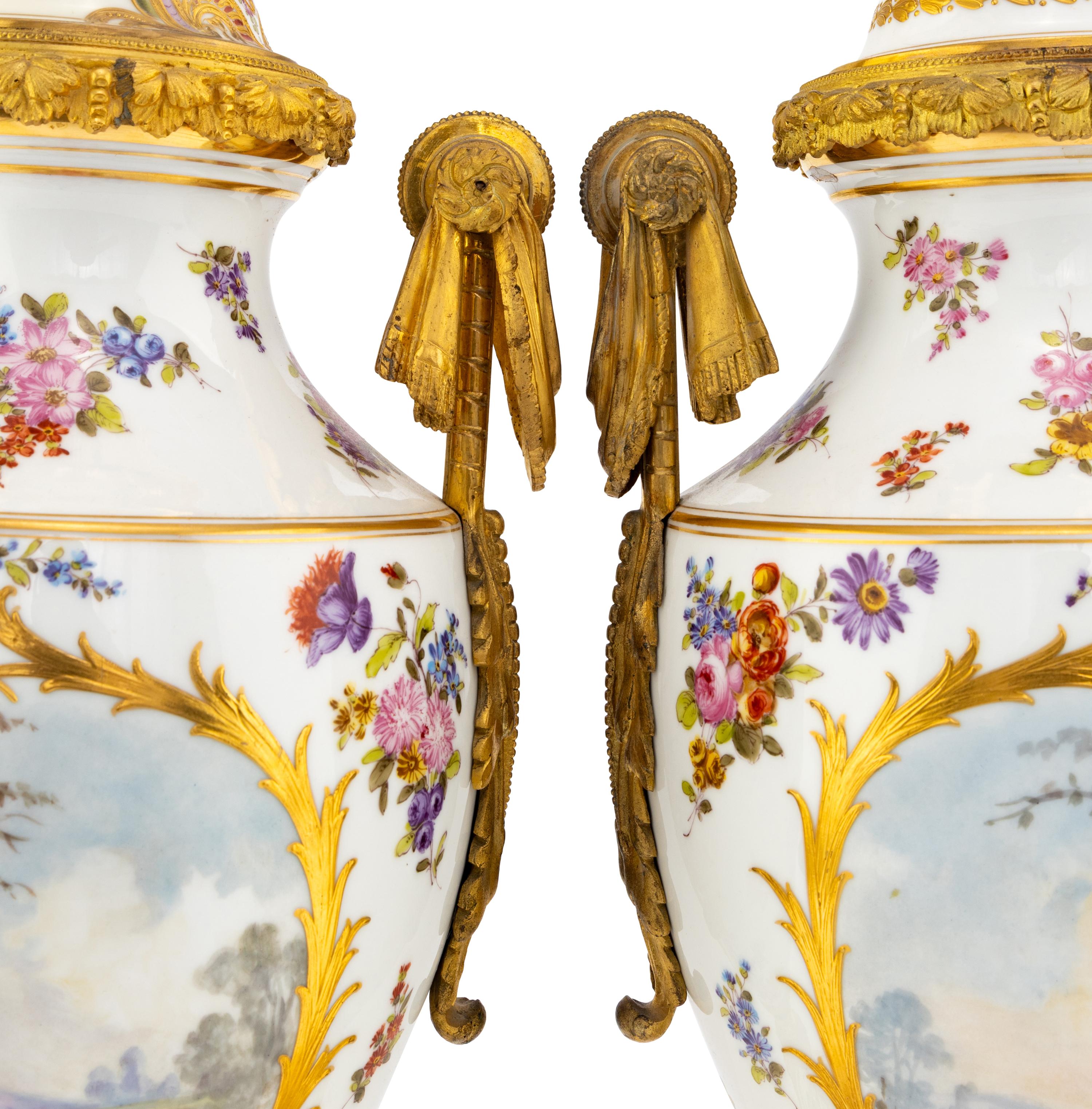 A Pair of Sèvres Style Porcelain and Gilt Bronze Mounted Urns