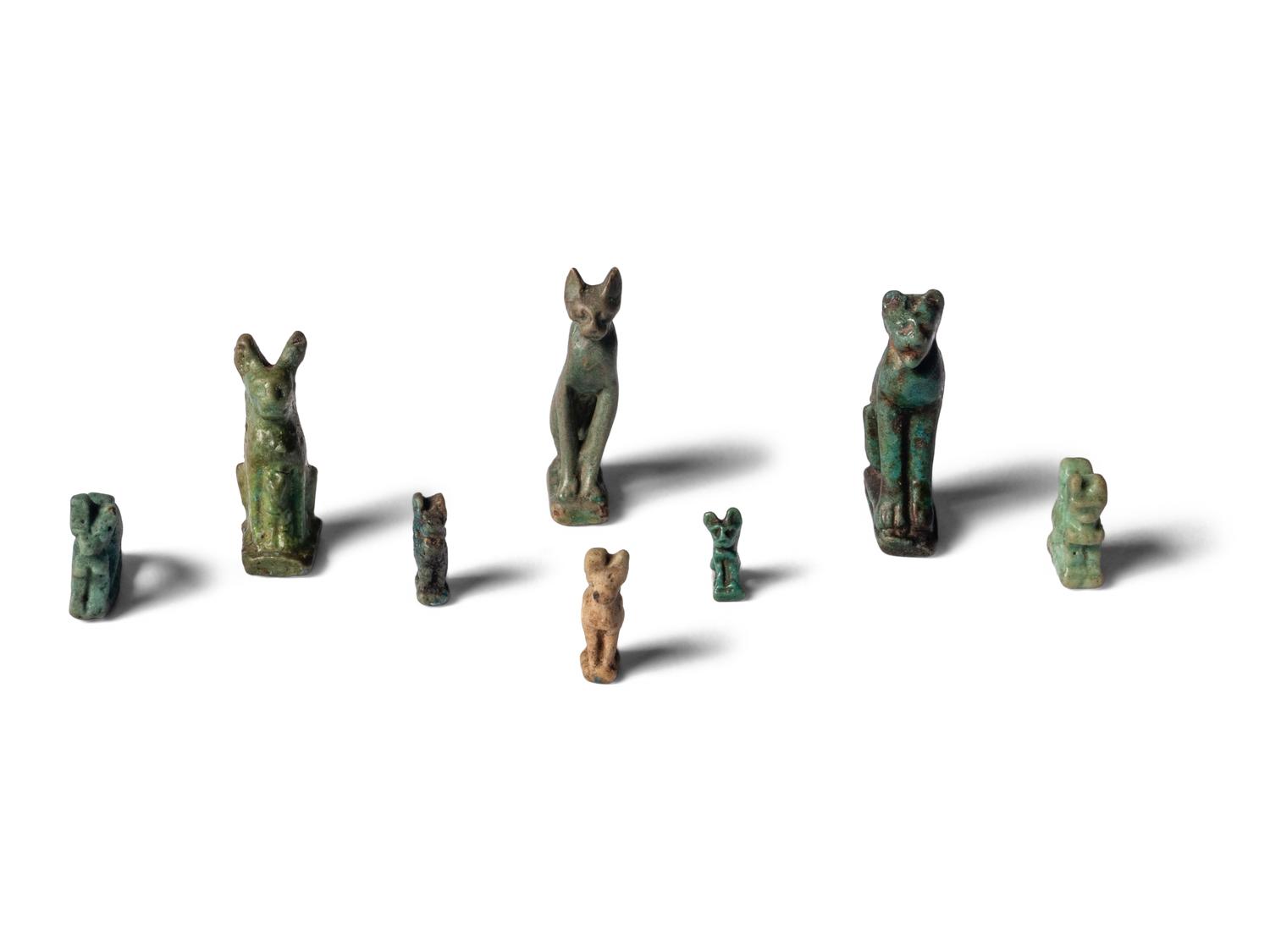 Eight Egyptian Faience Bastet Amulets