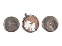 Corporal William L. Miller, Company G, 7th Indiana Volunteers. Bullet-struck pocket watch carried at the Battle of the Wilderness, which saved his life, with original bullet that almost ended it. May 1864.