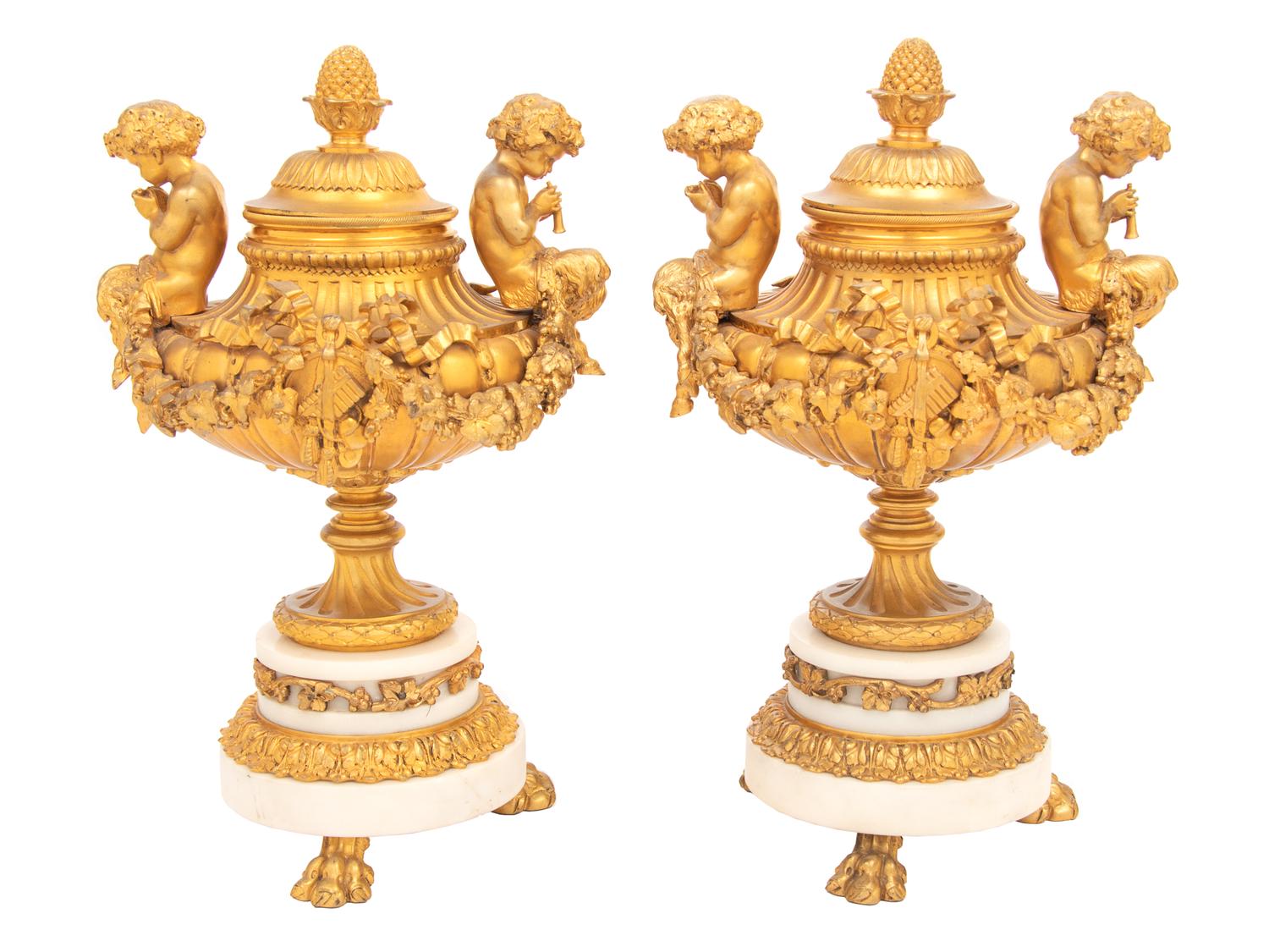 A Pair of Louis XVI Style Gilt Bronze and Marble Covered Urns