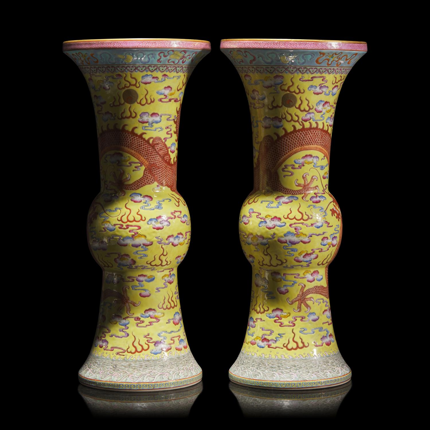 A Pair of Chinese Yellow Ground Finely Decorated Famille Rose 'Dragon' Vases 黃地粉彩雲龍紋花觚一對