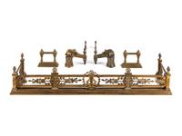 A French Gilt Metal Fireplace Suite
