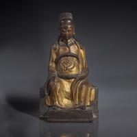 A Chinese Gilt-Lacquered Bronze Figure of a Seated Deity, Ming Dynasty — 明 銅漆金文昌公坐像
