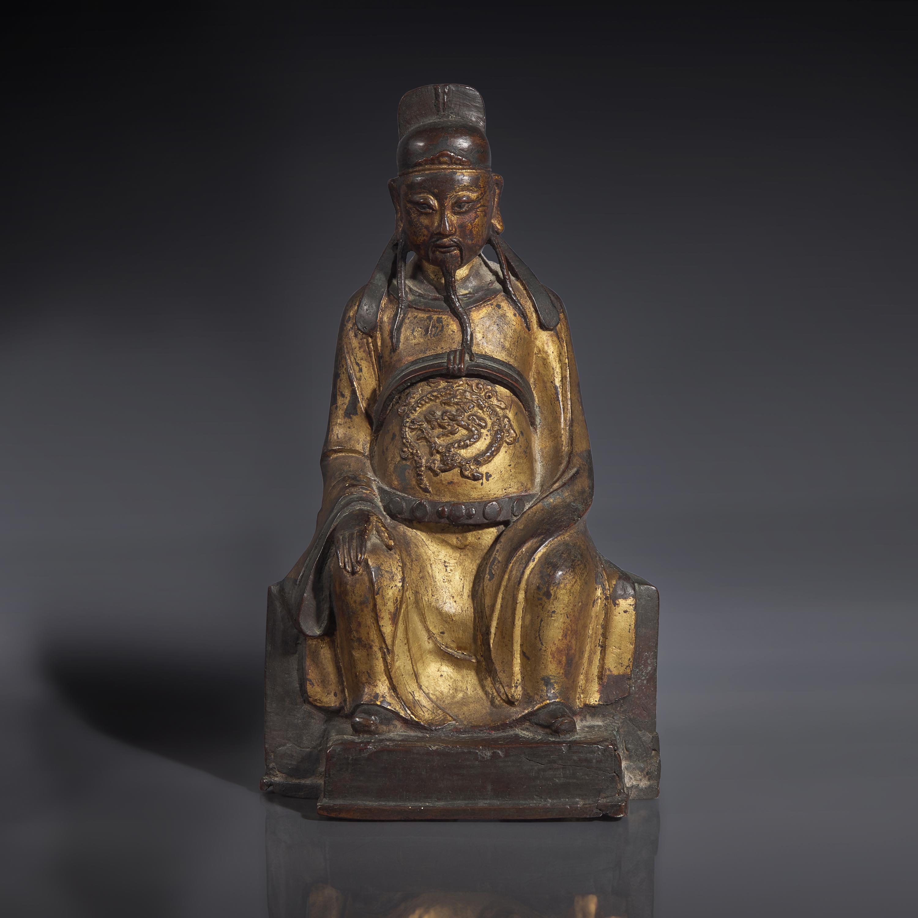 A Chinese Gilt-Lacquered Bronze Figure of a Seated Deity, Ming Dynasty — 明 銅漆金文昌公坐像