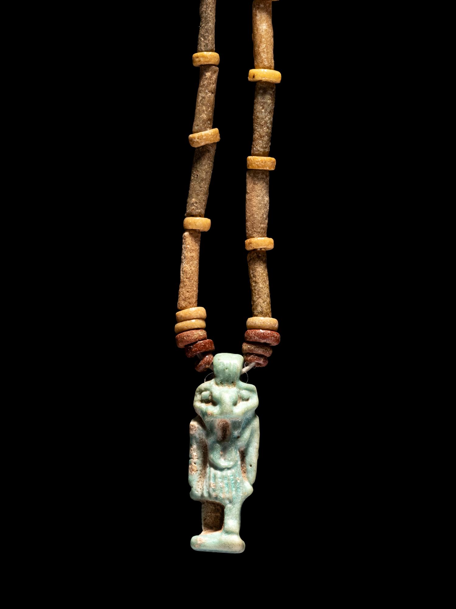 An Egyptian Bead and Faience Necklace with Khnum