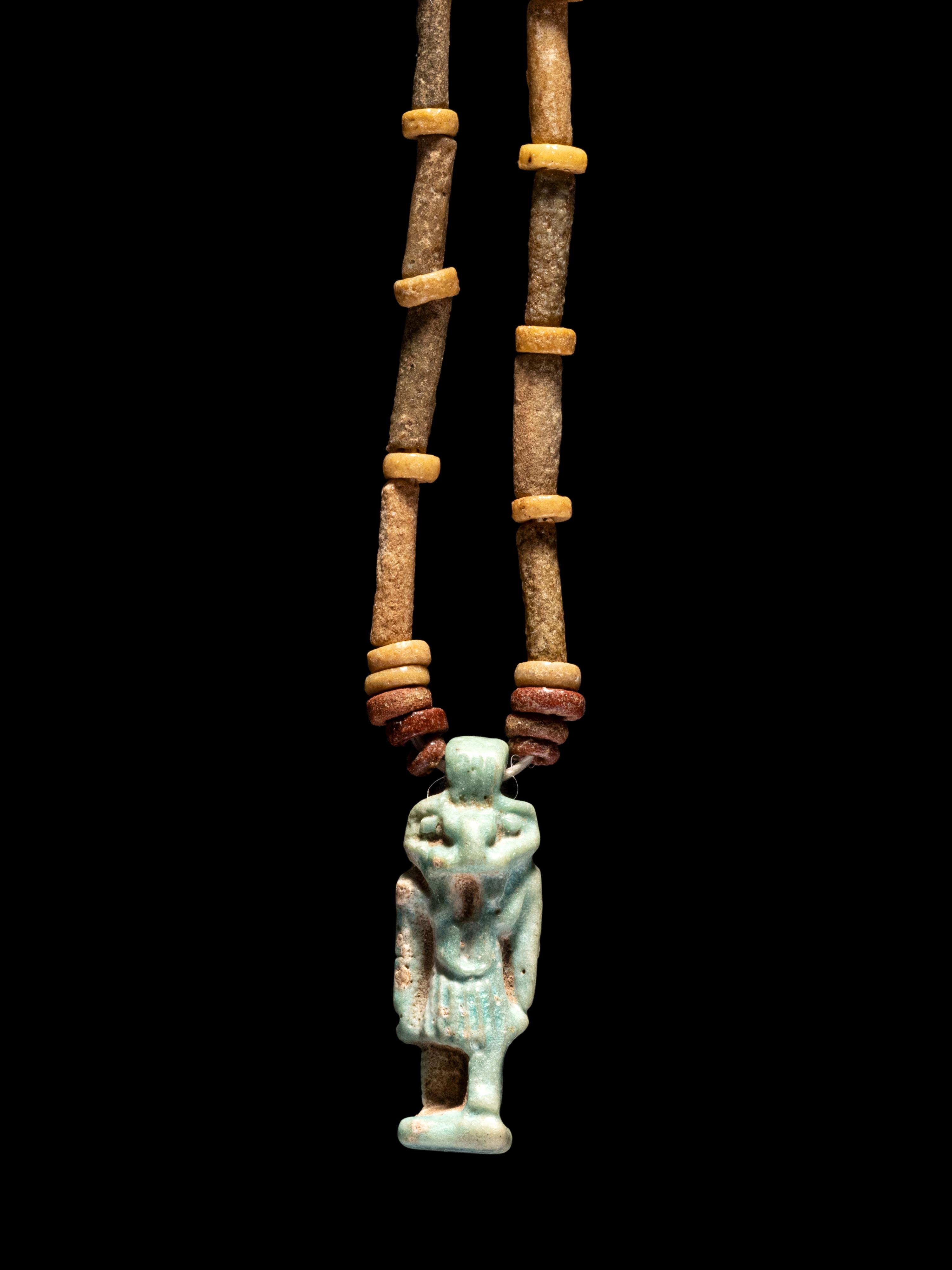 An Egyptian Bead and Faience Necklace with Khnum
