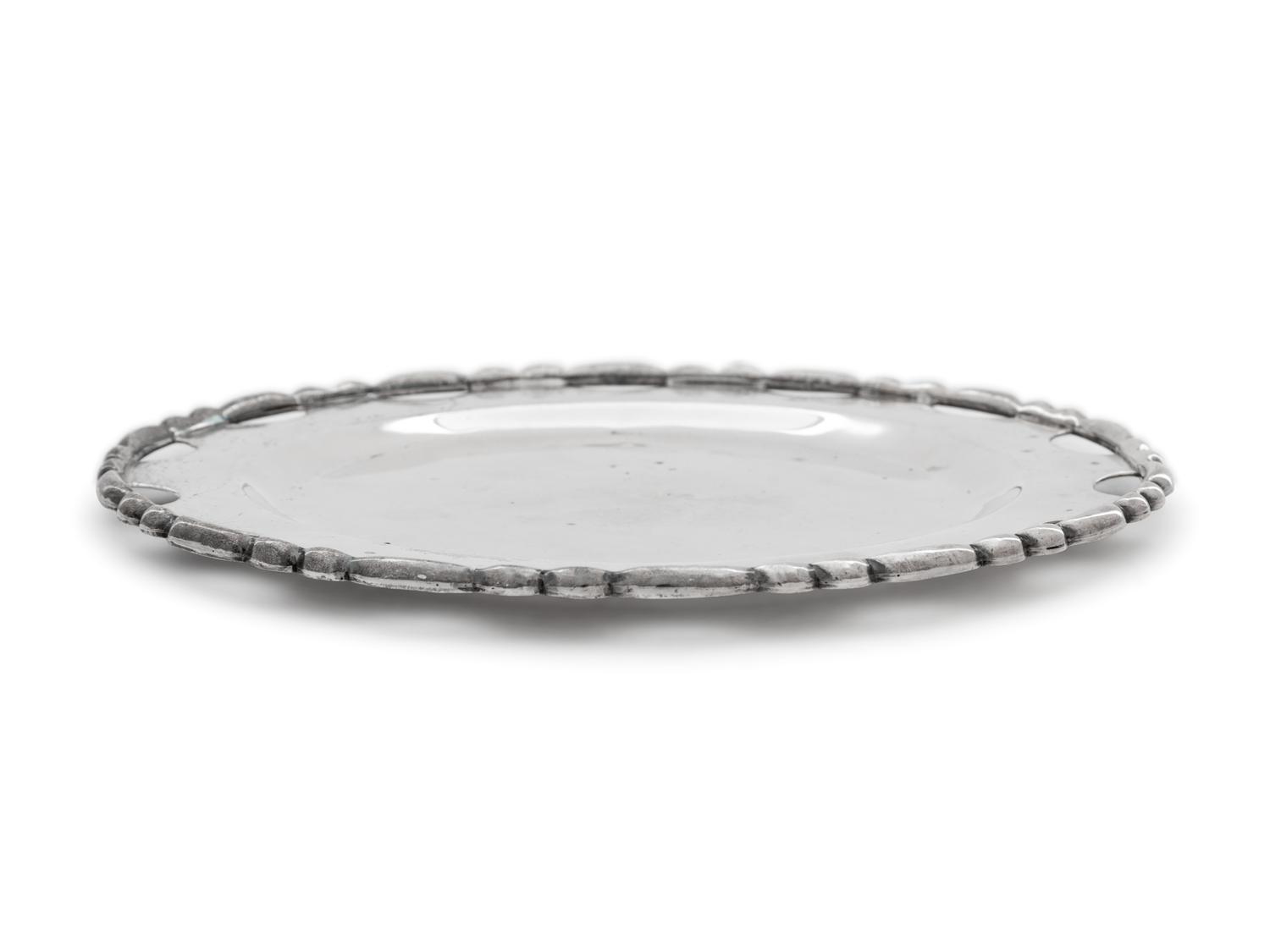 A Set of Twelve Mexican Silver Bread Plates