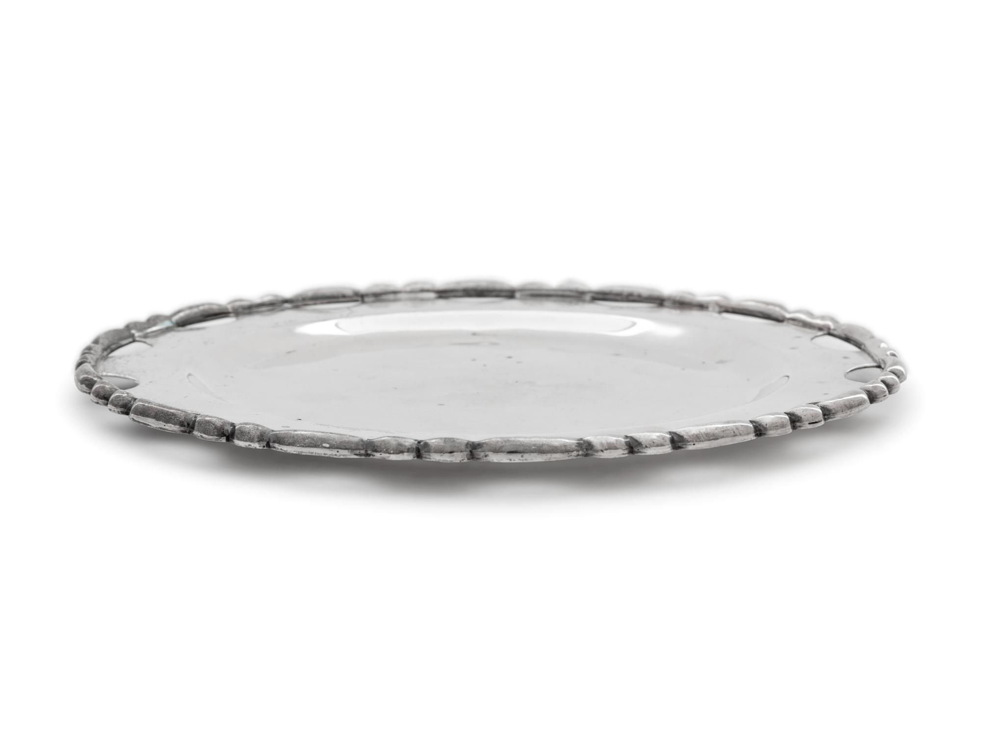 A Set of Twelve Mexican Silver Bread Plates