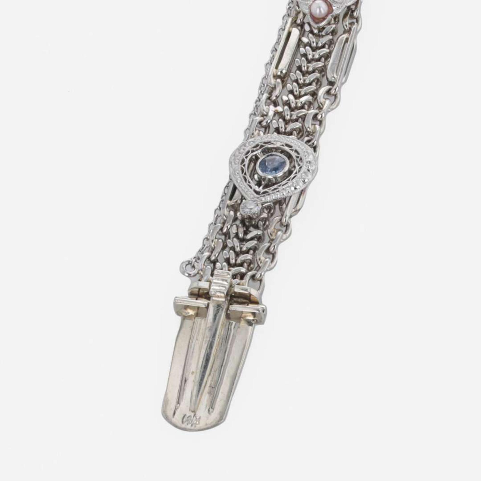 A 14 Karat White Gold and Diamond Bracelet