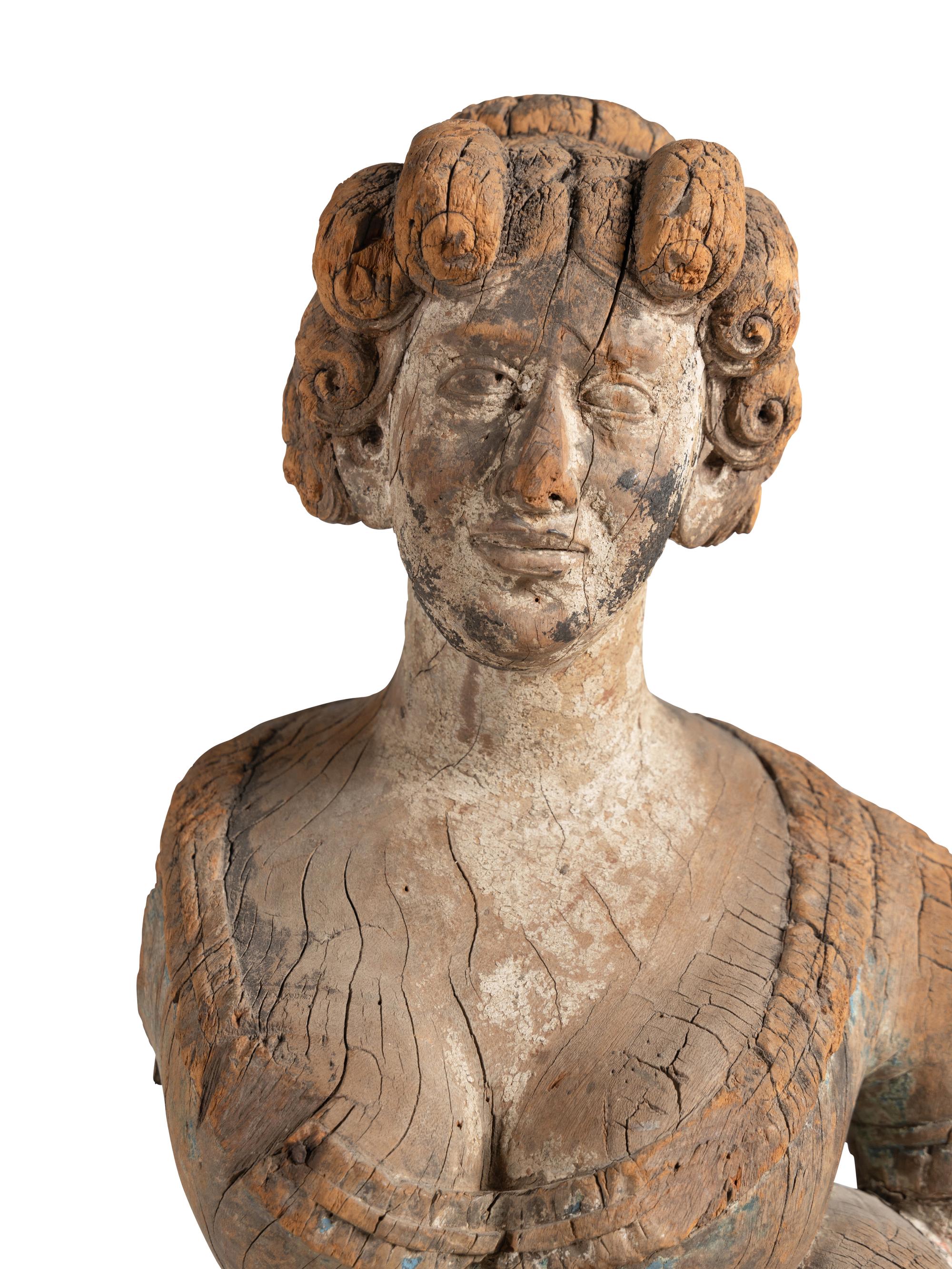 A Carved Wood Maiden Form Masthead