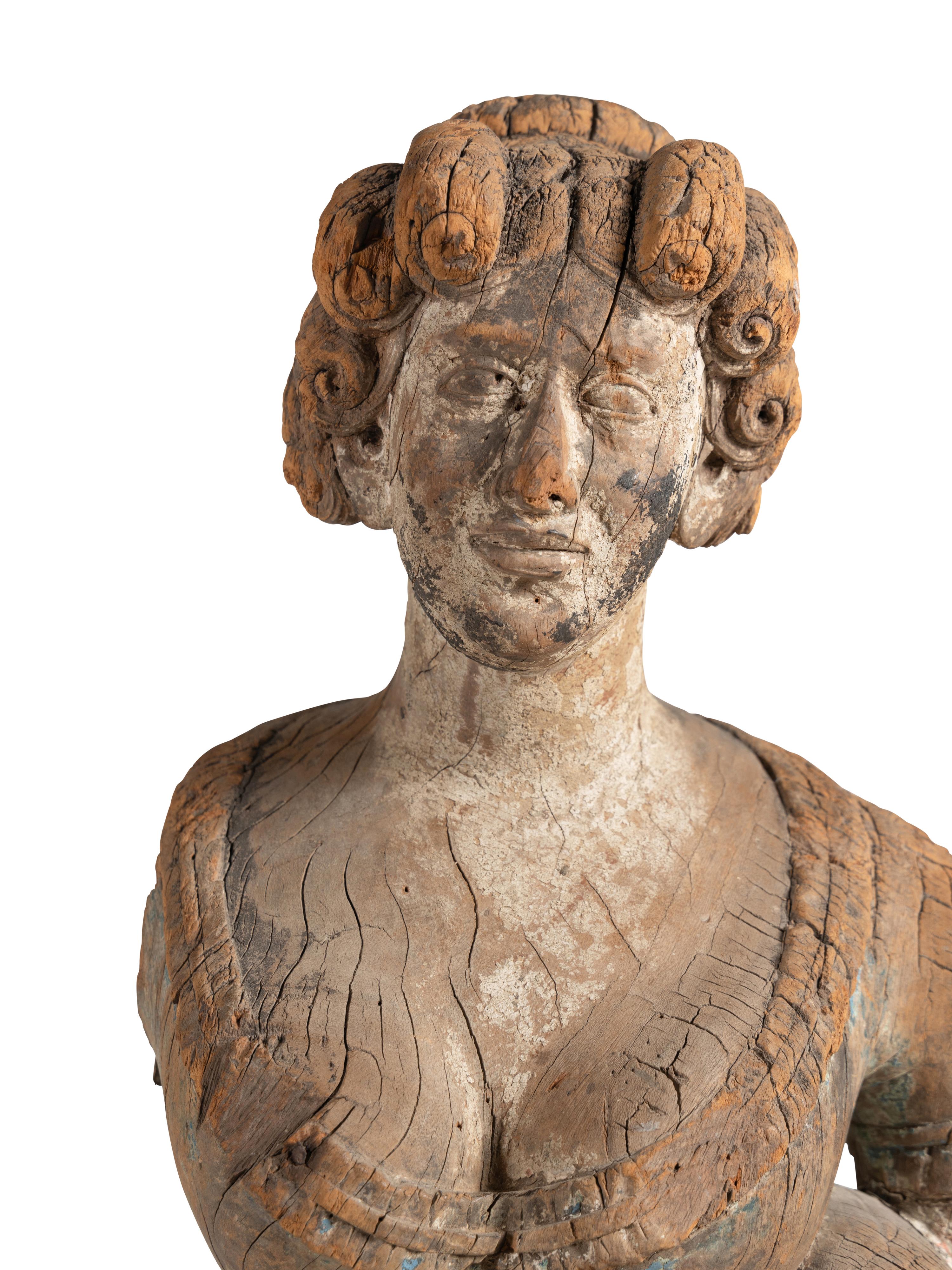 A Carved Wood Maiden Form Masthead