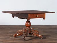 A Classical Highly Carved Cherrywood Drop-Leaf Dining Table