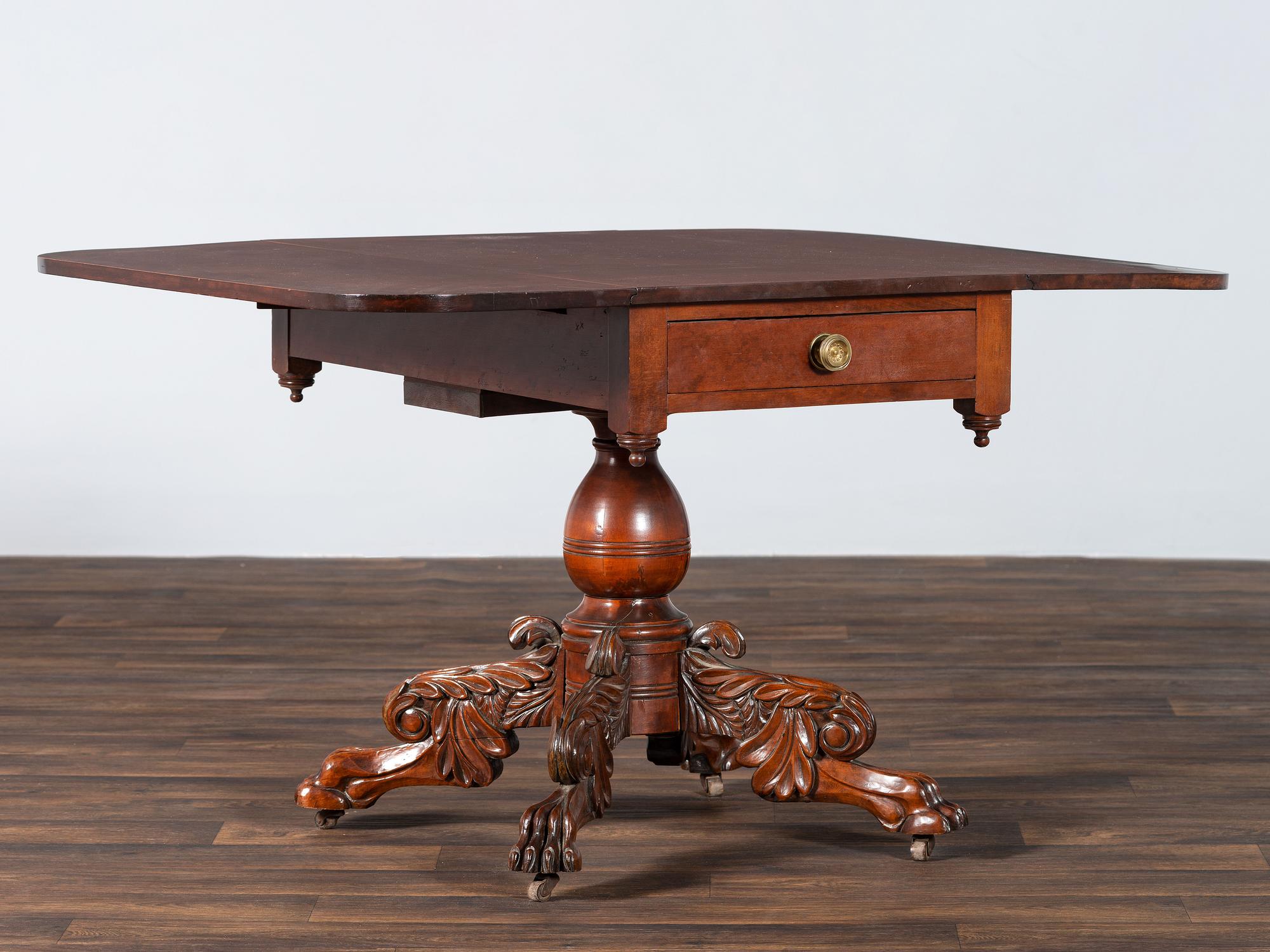 A Classical Highly Carved Cherrywood Drop-Leaf Dining Table