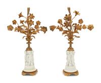 A Pair of Gilt Metal Mounted Bisque Porcelain Figural Ornaments