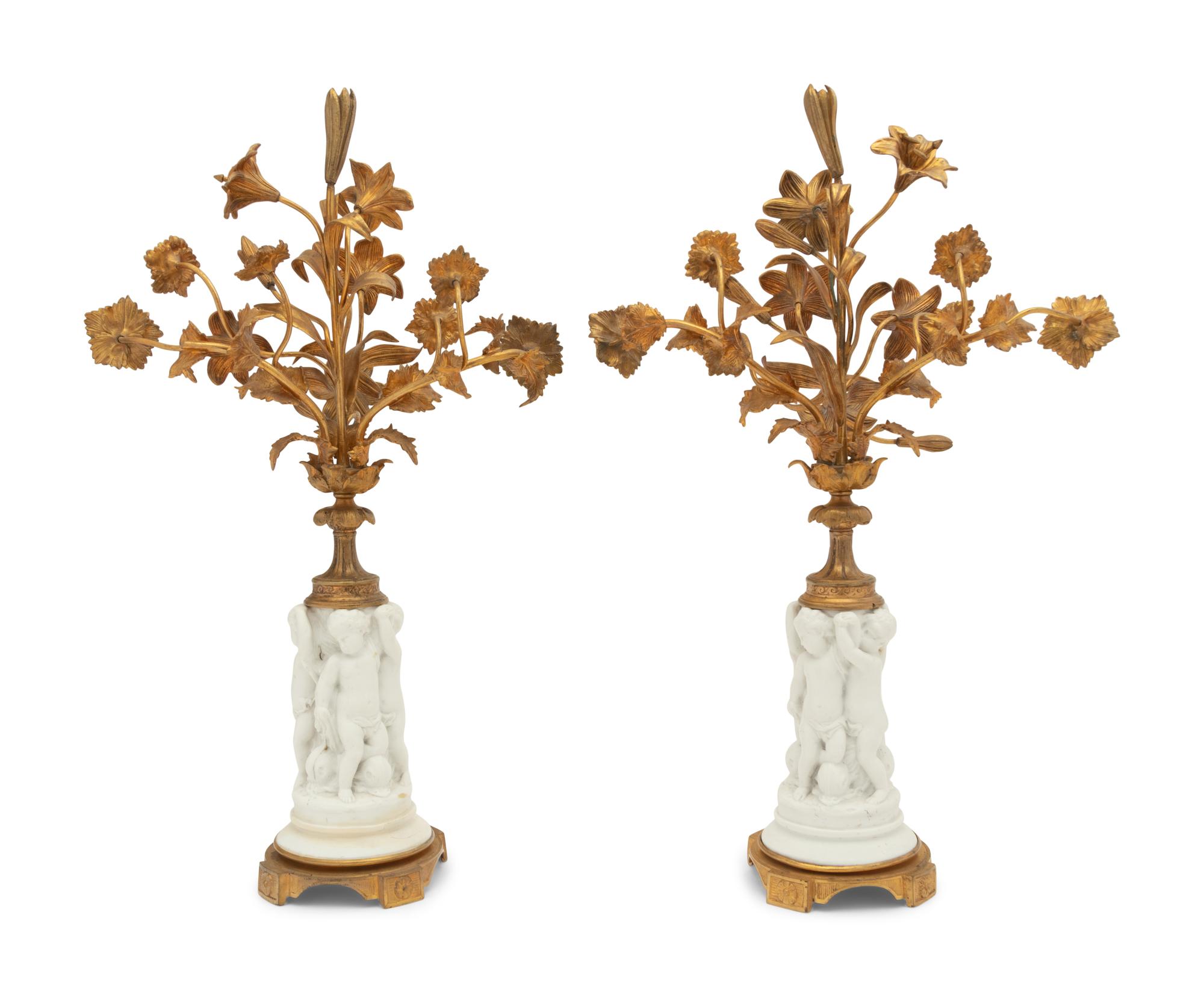 A Pair of Gilt Metal Mounted Bisque Porcelain Figural Ornaments