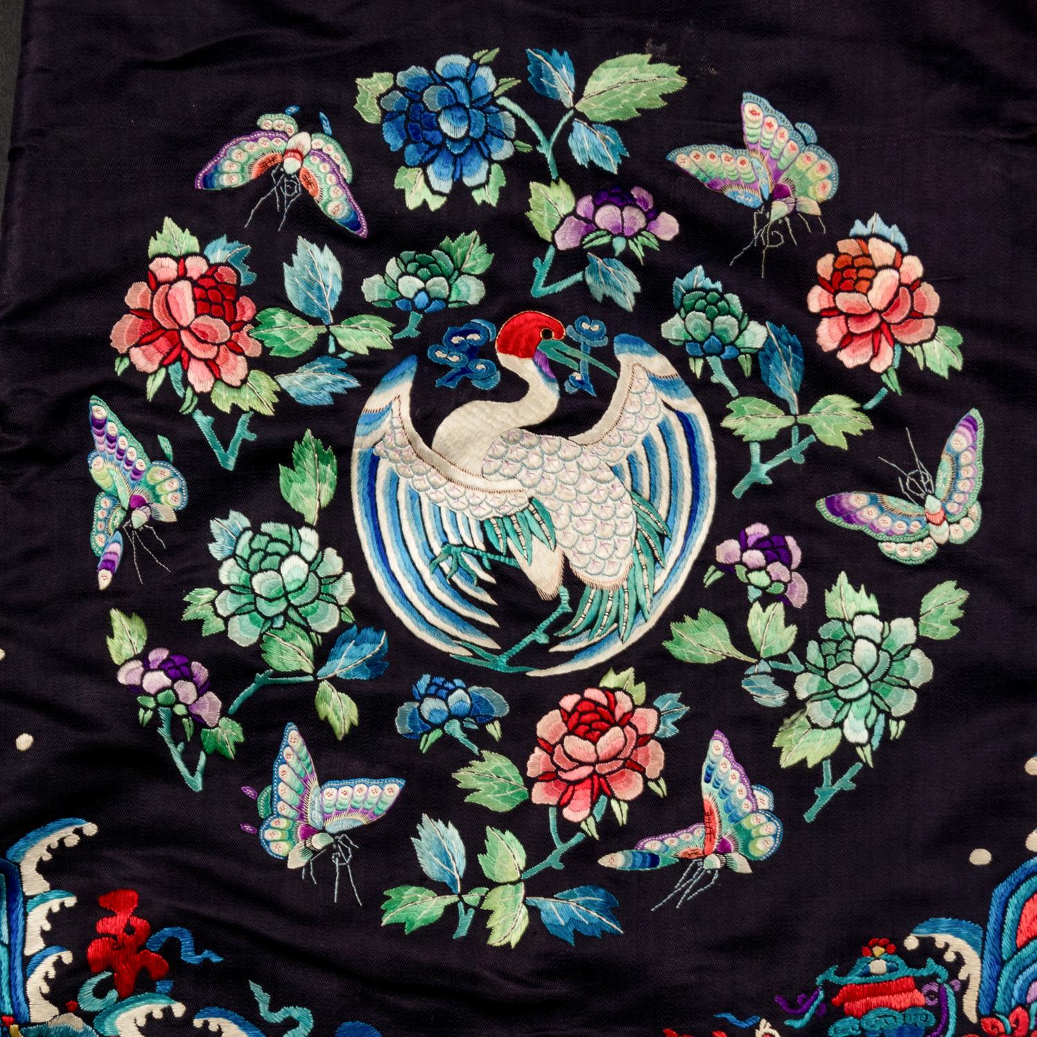 A Chinese Navy Satin Ground Embroidered Silk 'Dragon and Crane' Robe, Qiagua , Late 19th Century 清晚期 石青緞地綉龍紋團鶴紋袷褂