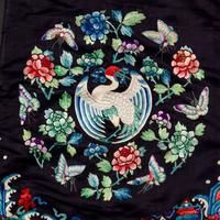 A Chinese Navy Satin Ground Embroidered Silk 'Dragon and Crane' Robe, Qiagua , Late 19th Century 清晚期 石青緞地綉龍紋團鶴紋袷褂