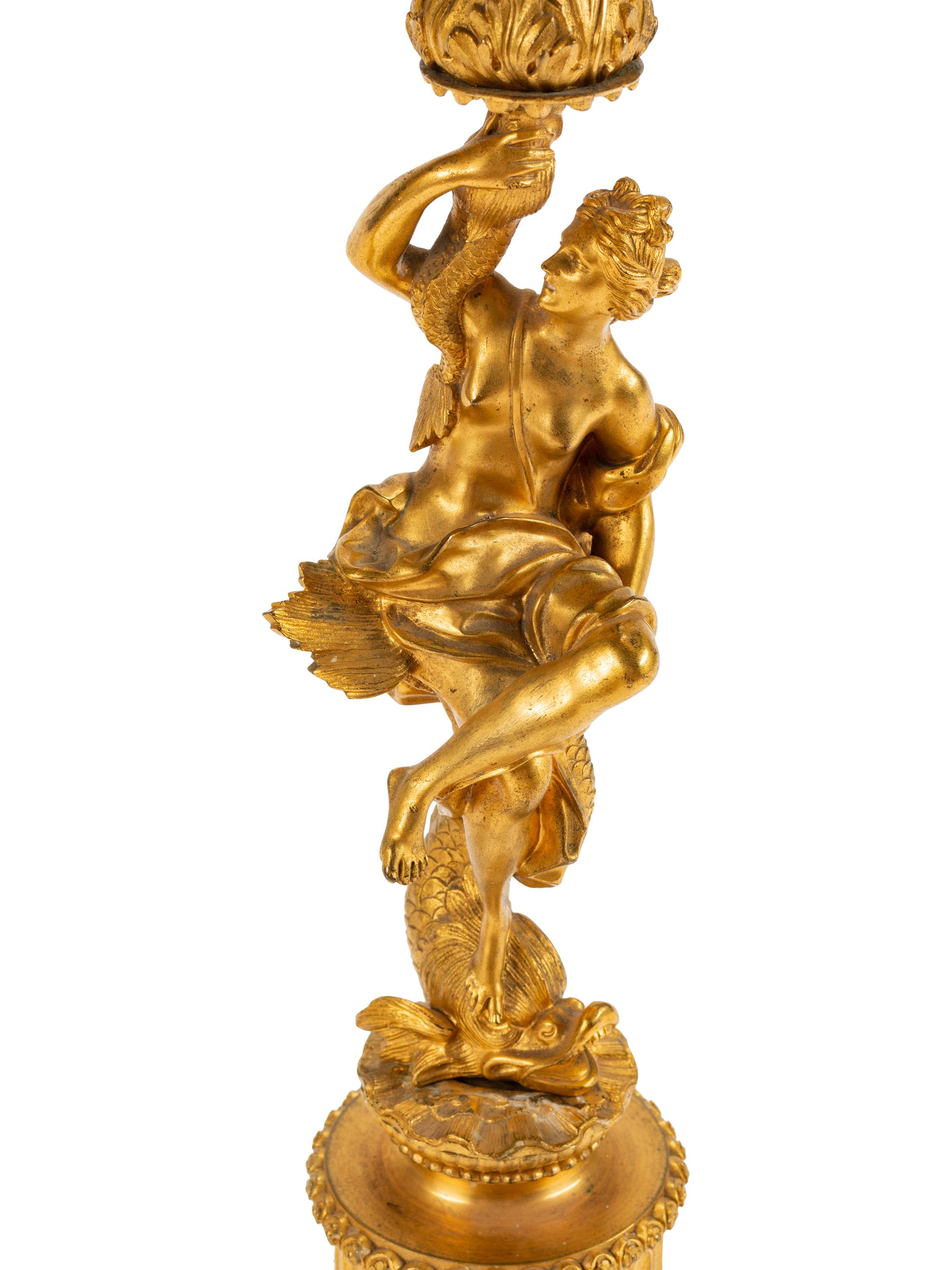 A Pair of Continental Gilt Bronze Figural Five-Light Candelabra with Malachite Veneered Bases