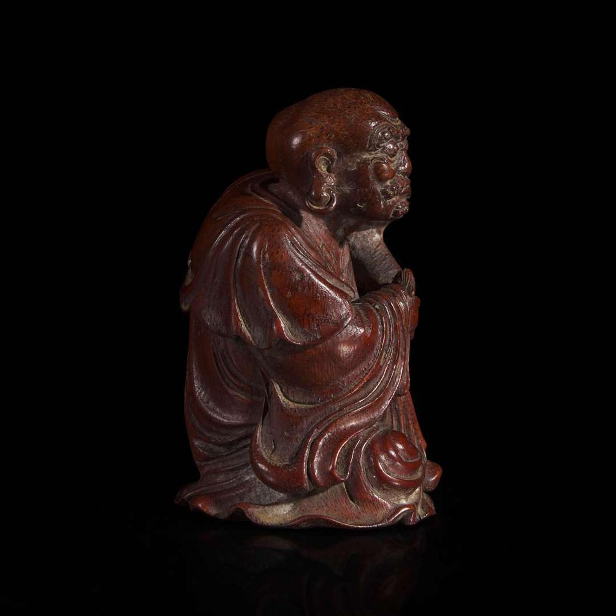 A Chinese finely-carved bamboo luohan and lion 竹雕笑狮罗汉 Qing dynasty ?