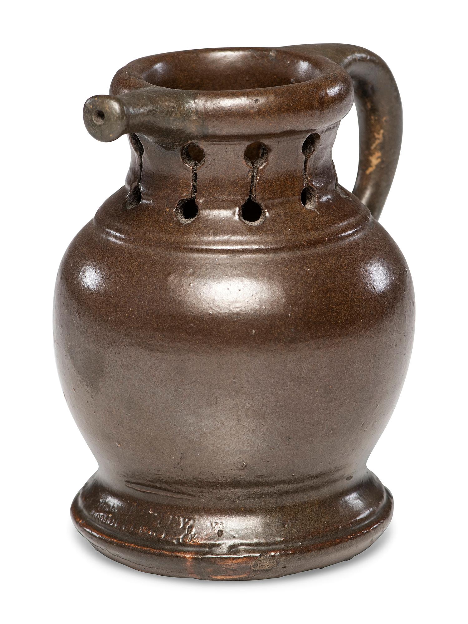 A Rare William Rowley Slip-Glazed Puzzle Jug