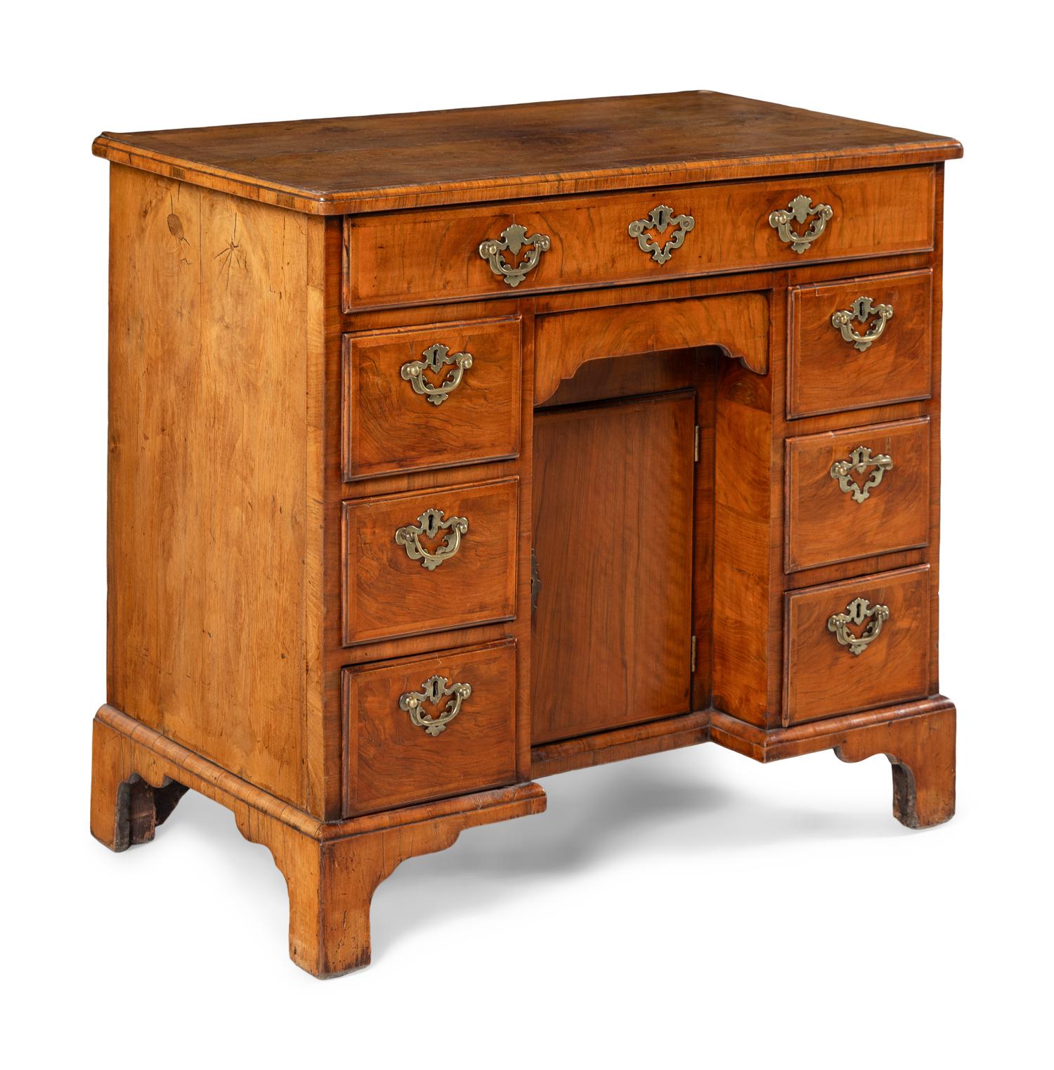 A George II Walnut Kneehole Desk