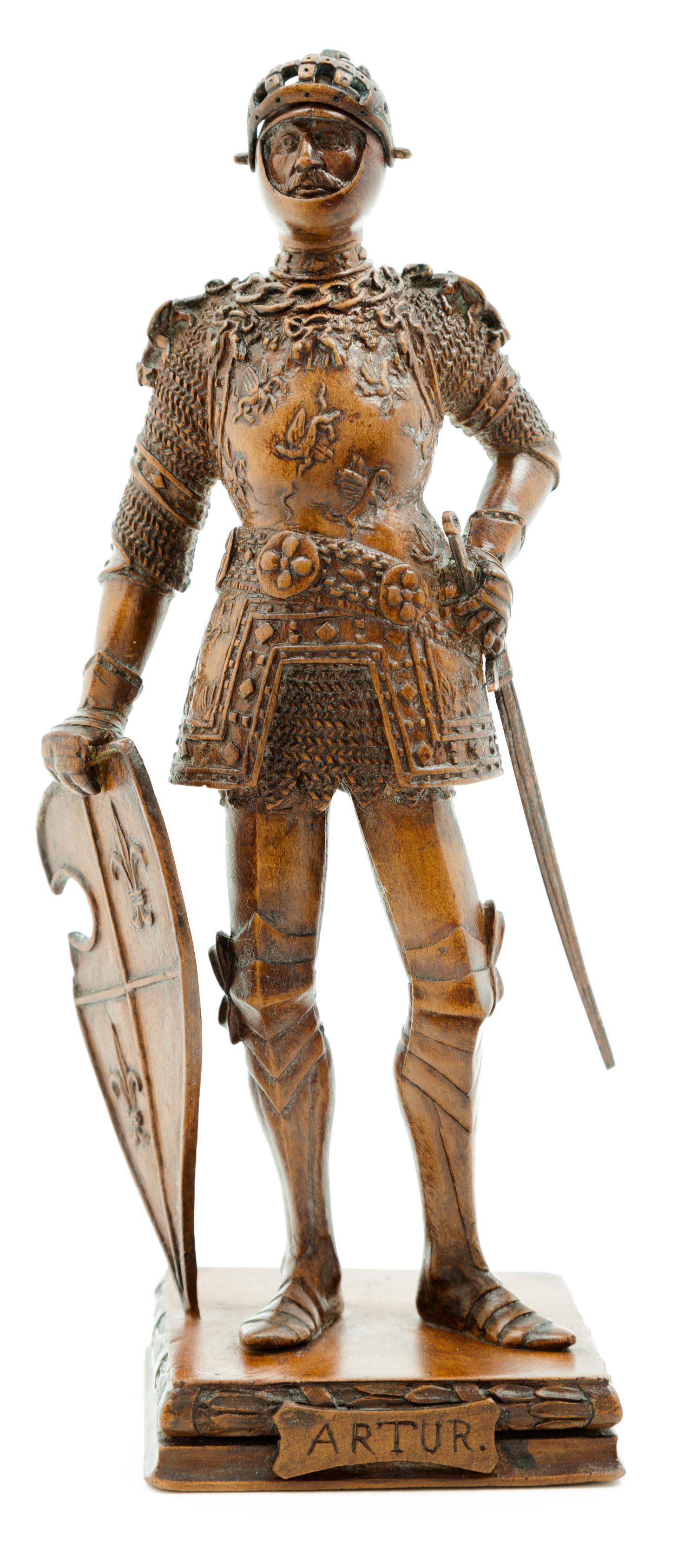 A German Carved Wood Figure of a Knight Height overall 9 3/8 inches.