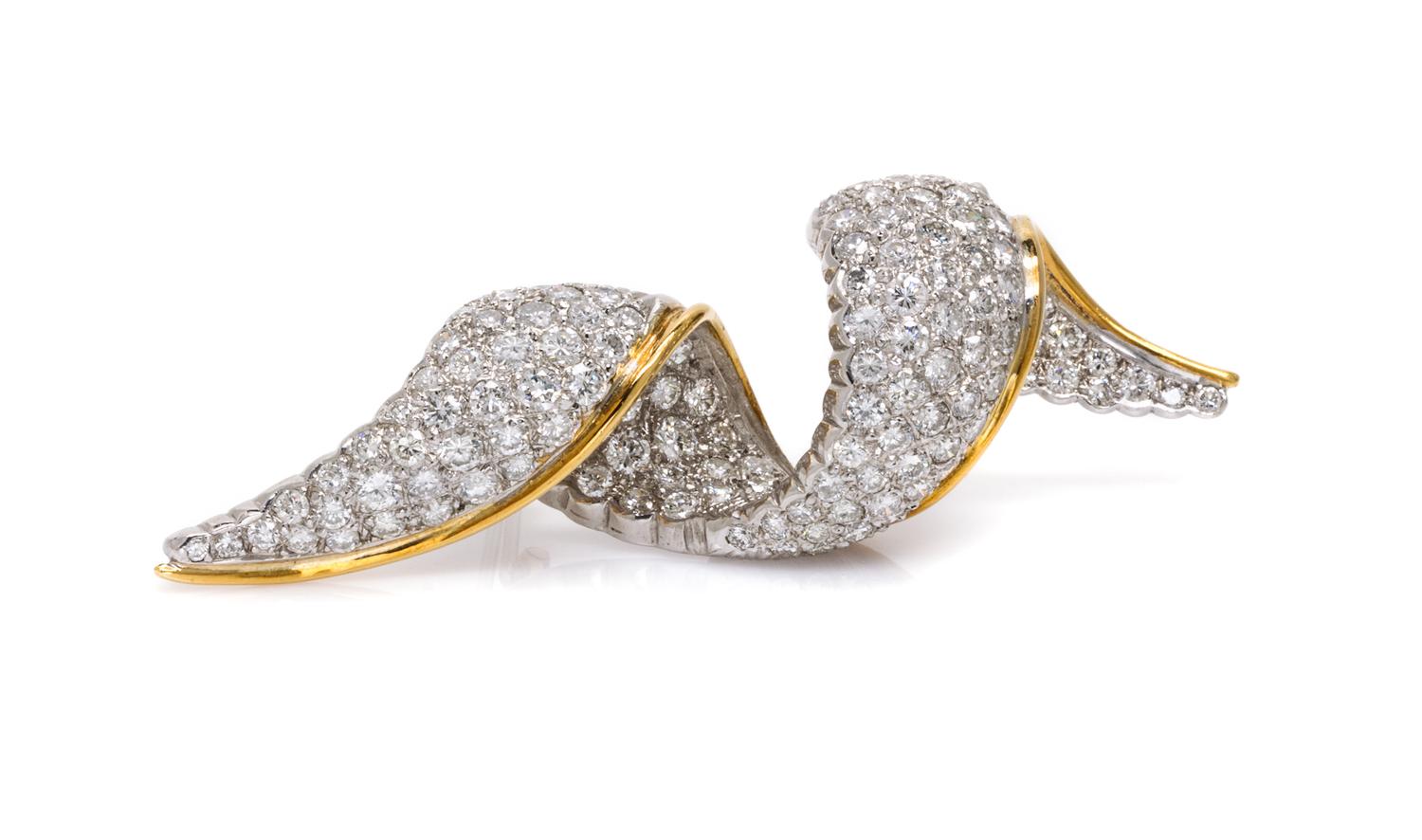 A Platinum, 18 Karat Yellow Gold and Diamond Swirl Brooch, 21.80 dwts.