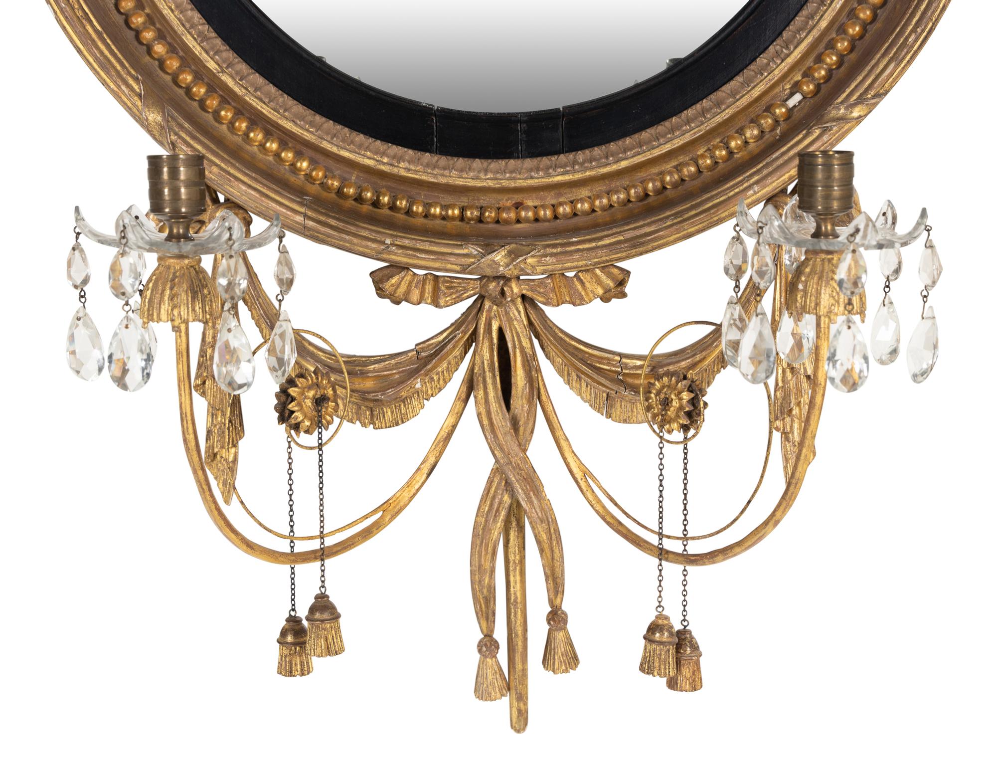 A George III Giltwood and Parcel-Ebonized Girandole Mirror