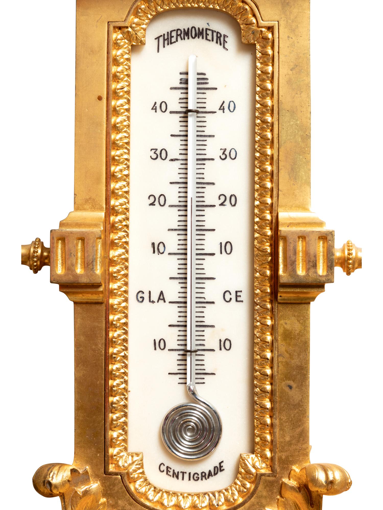 A Louis XVI Style Gilt Bronze Barometer and Thermometer