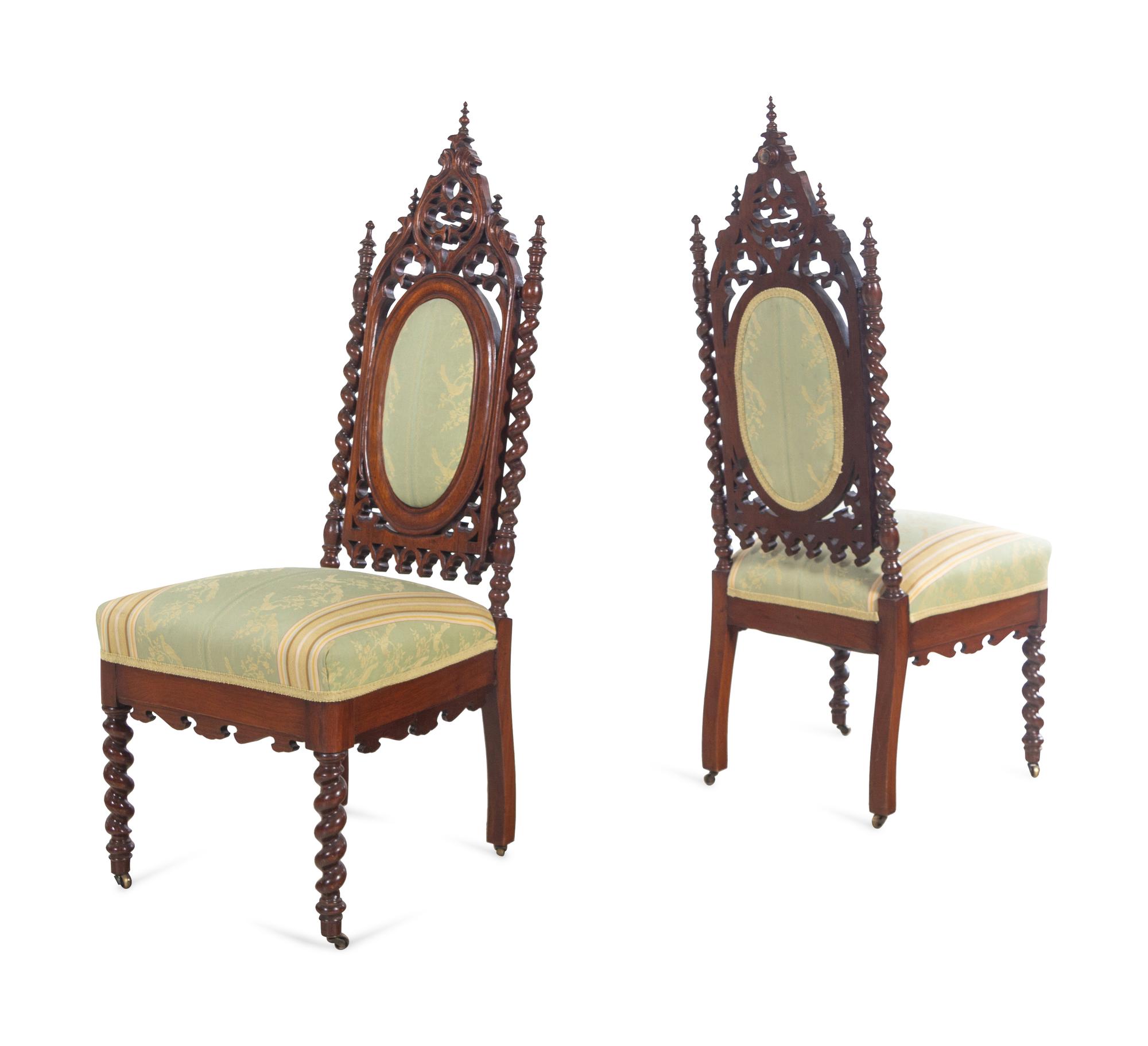 A Pair of Gothic Revival Carved Walnut Side Chairs
