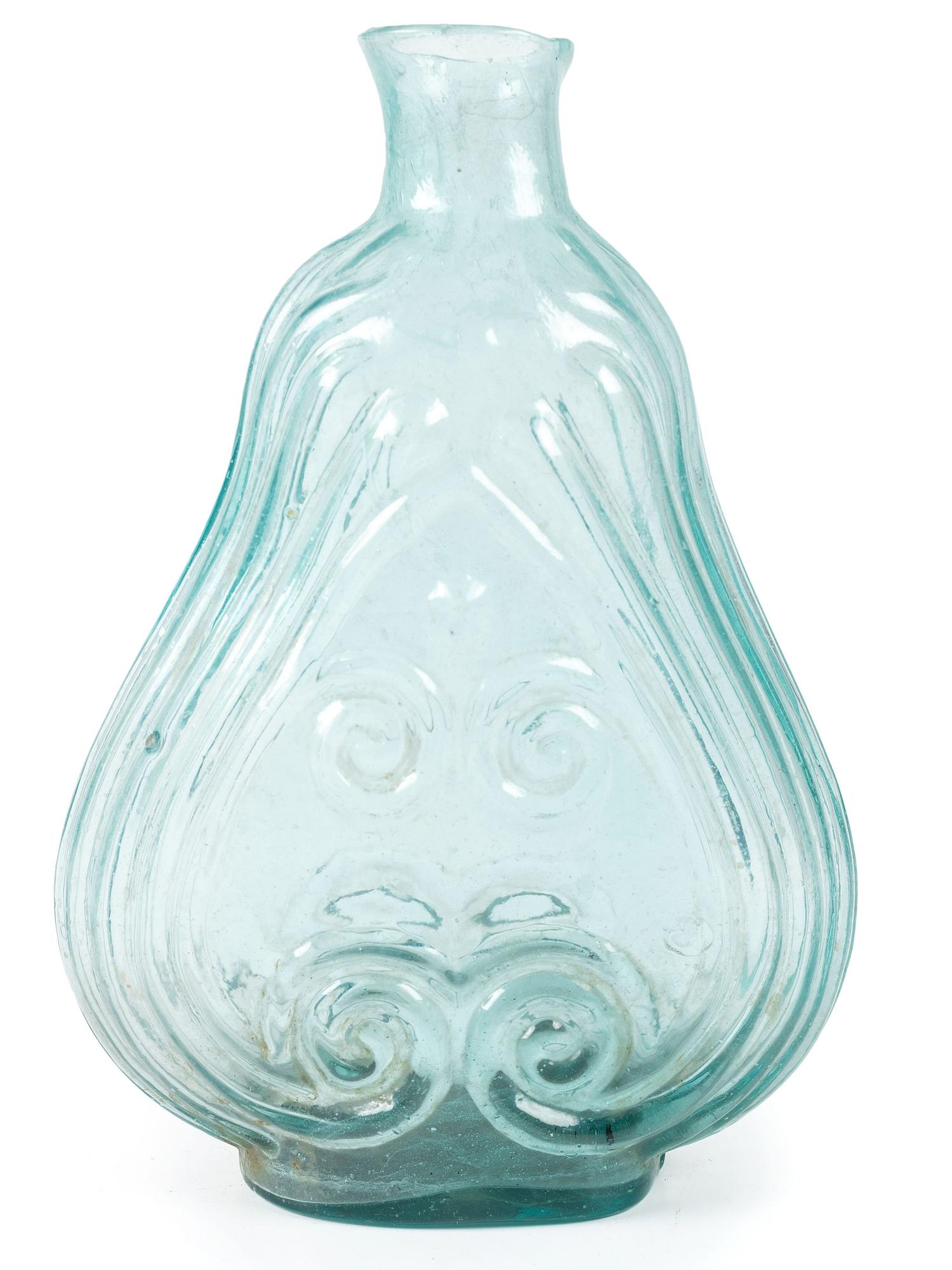 An Early Blown Glass Scroll Flask in Aquamarine