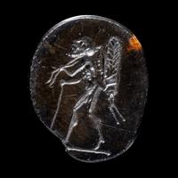 A Roman Sardonyx Ring Stone with a Pygmy and Locust