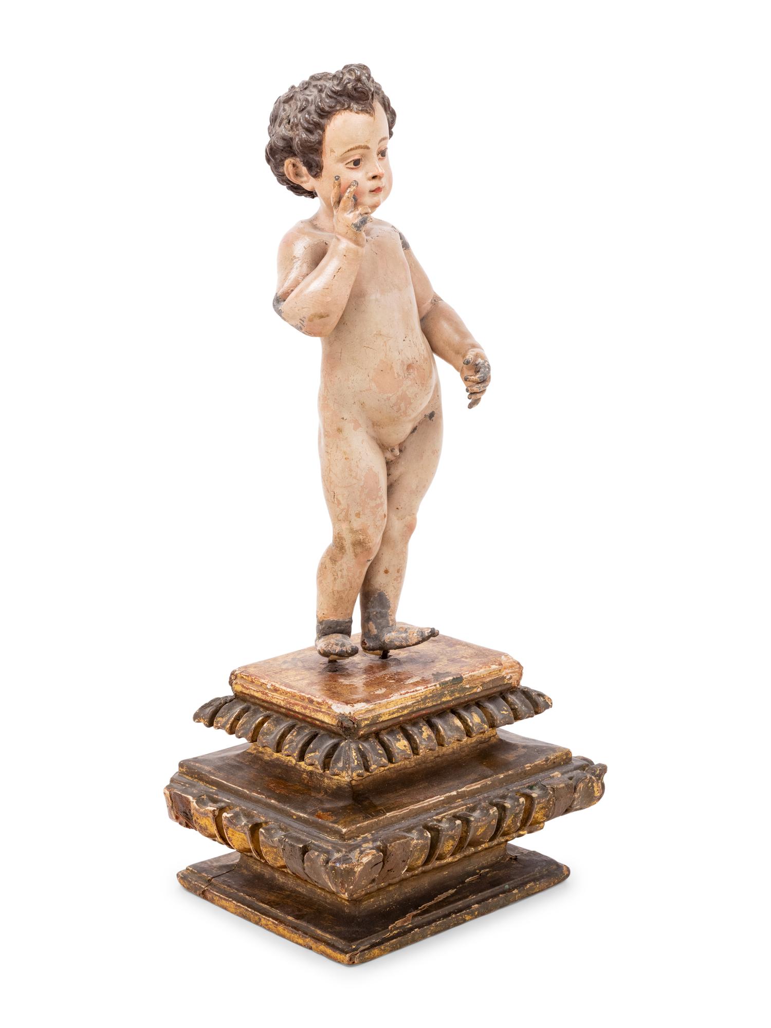 An Italian Painted Putto Figure